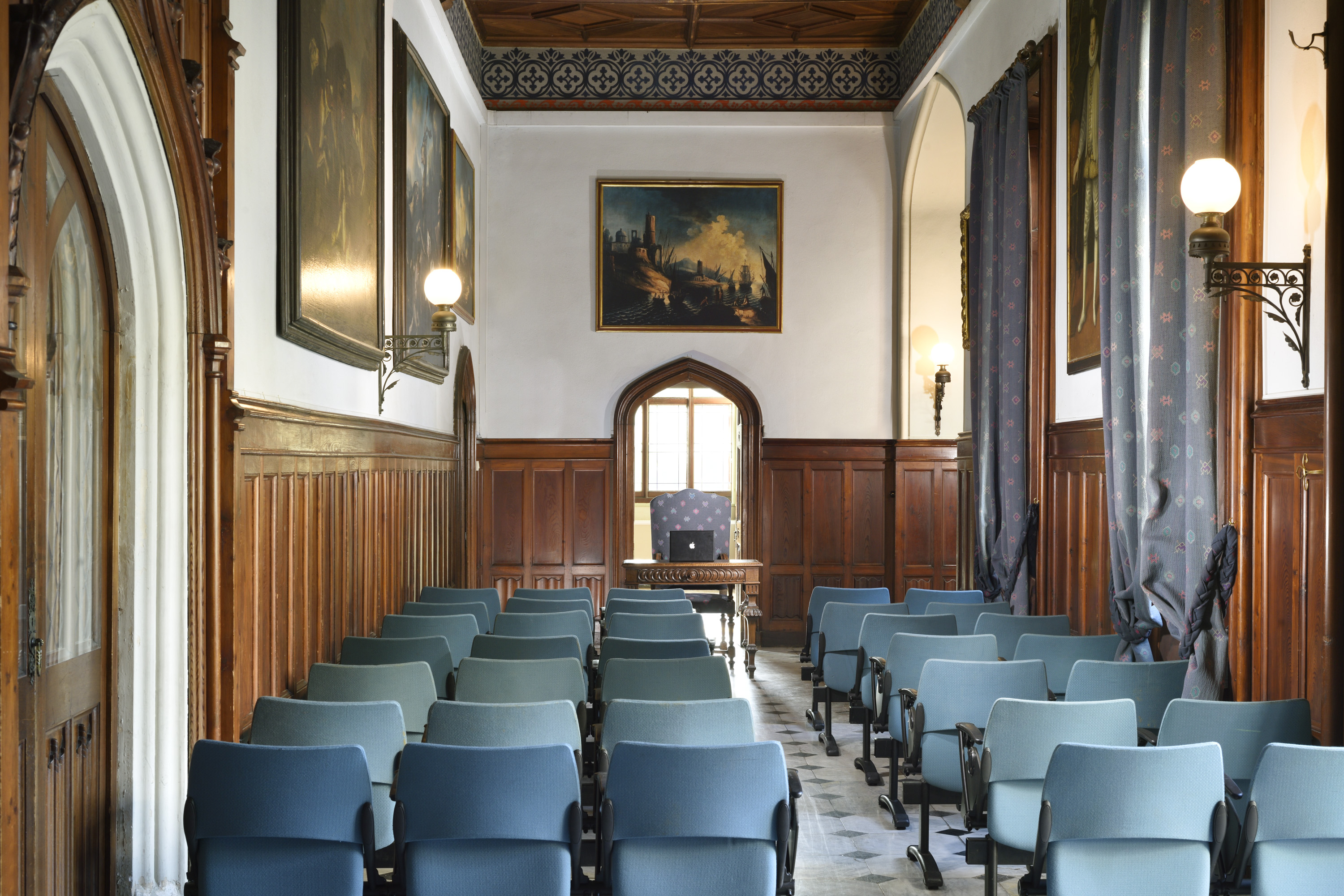 a room with blue chairs and a table