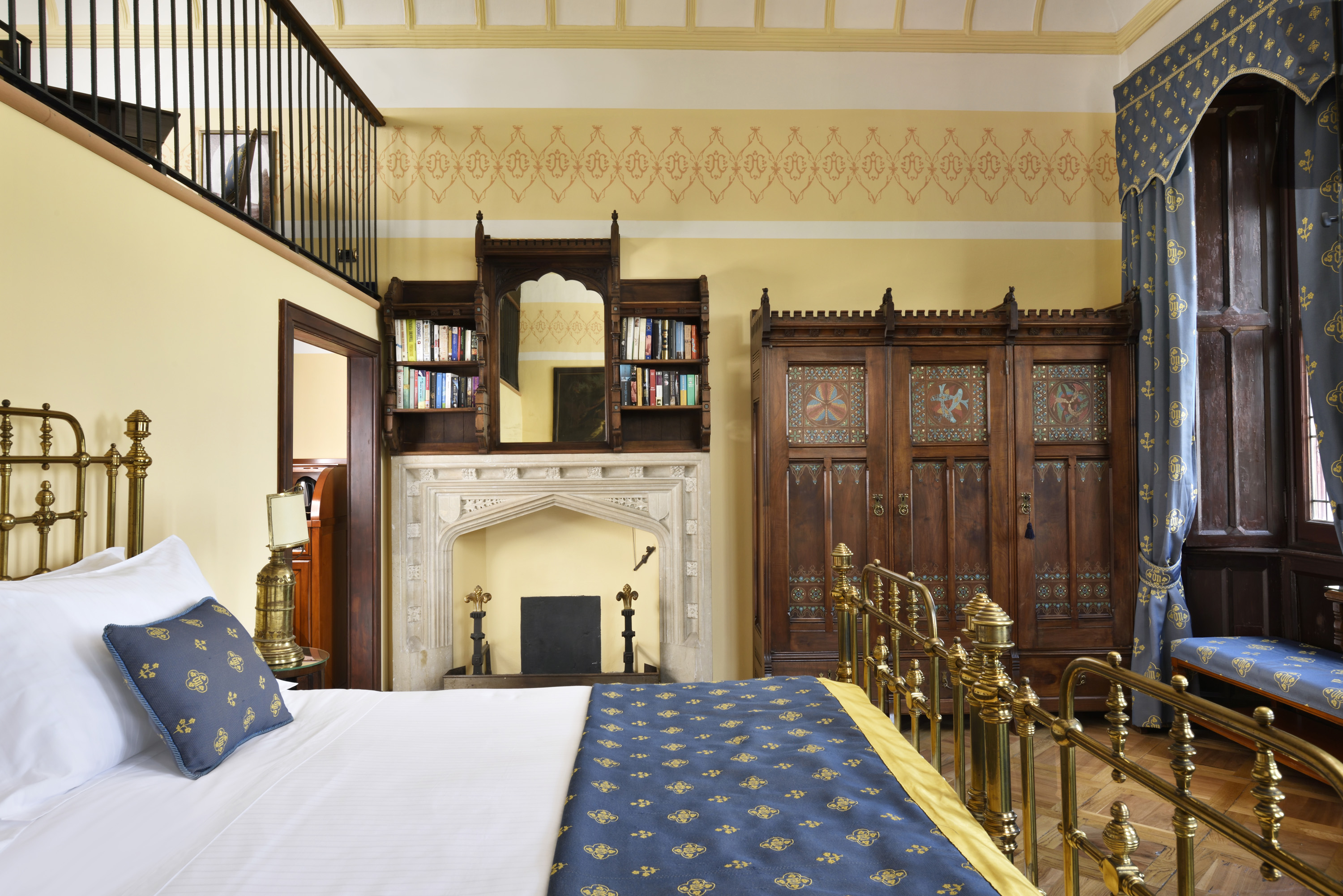 a bedroom with a bed and a fireplace