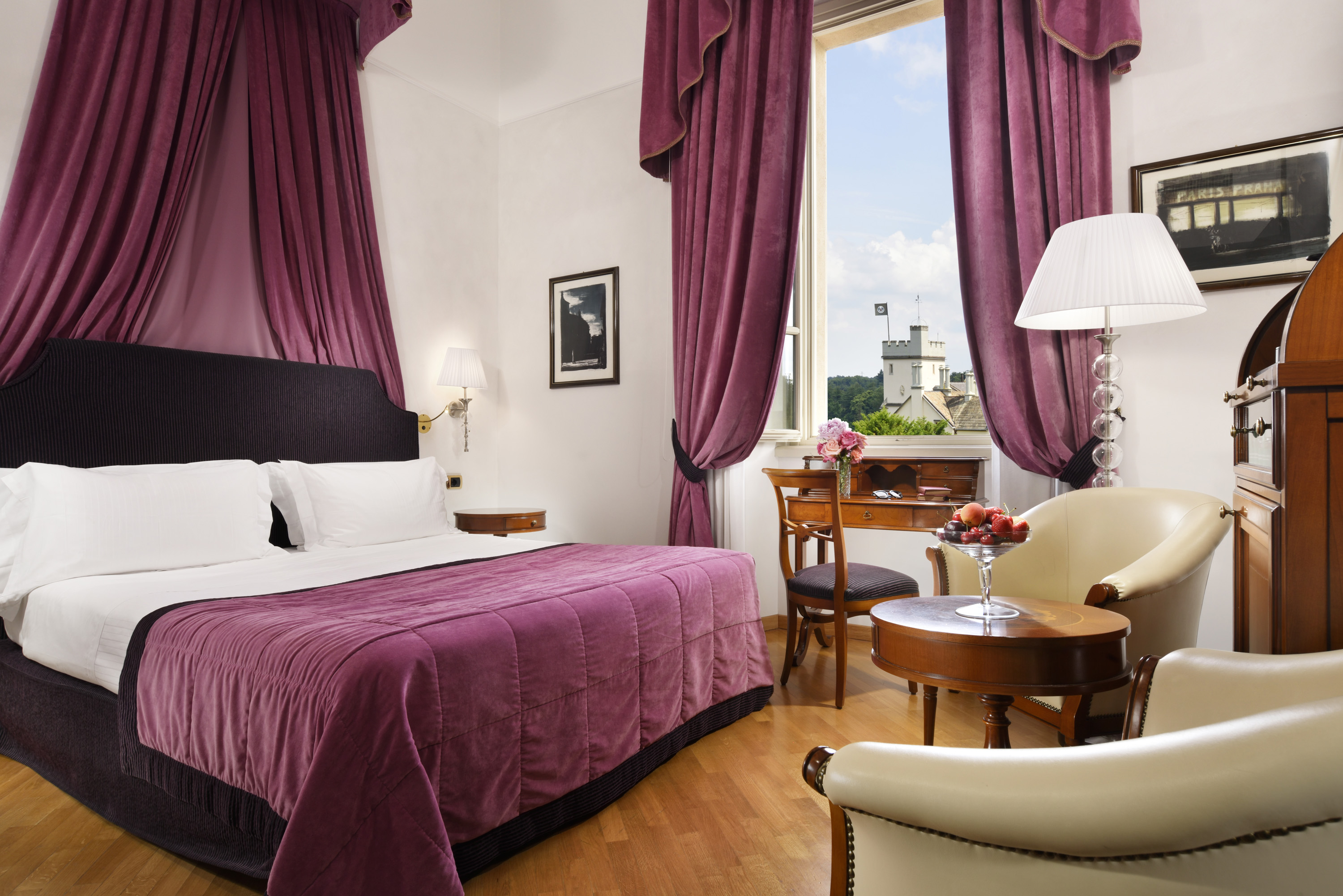 a room with purple curtains and a bed