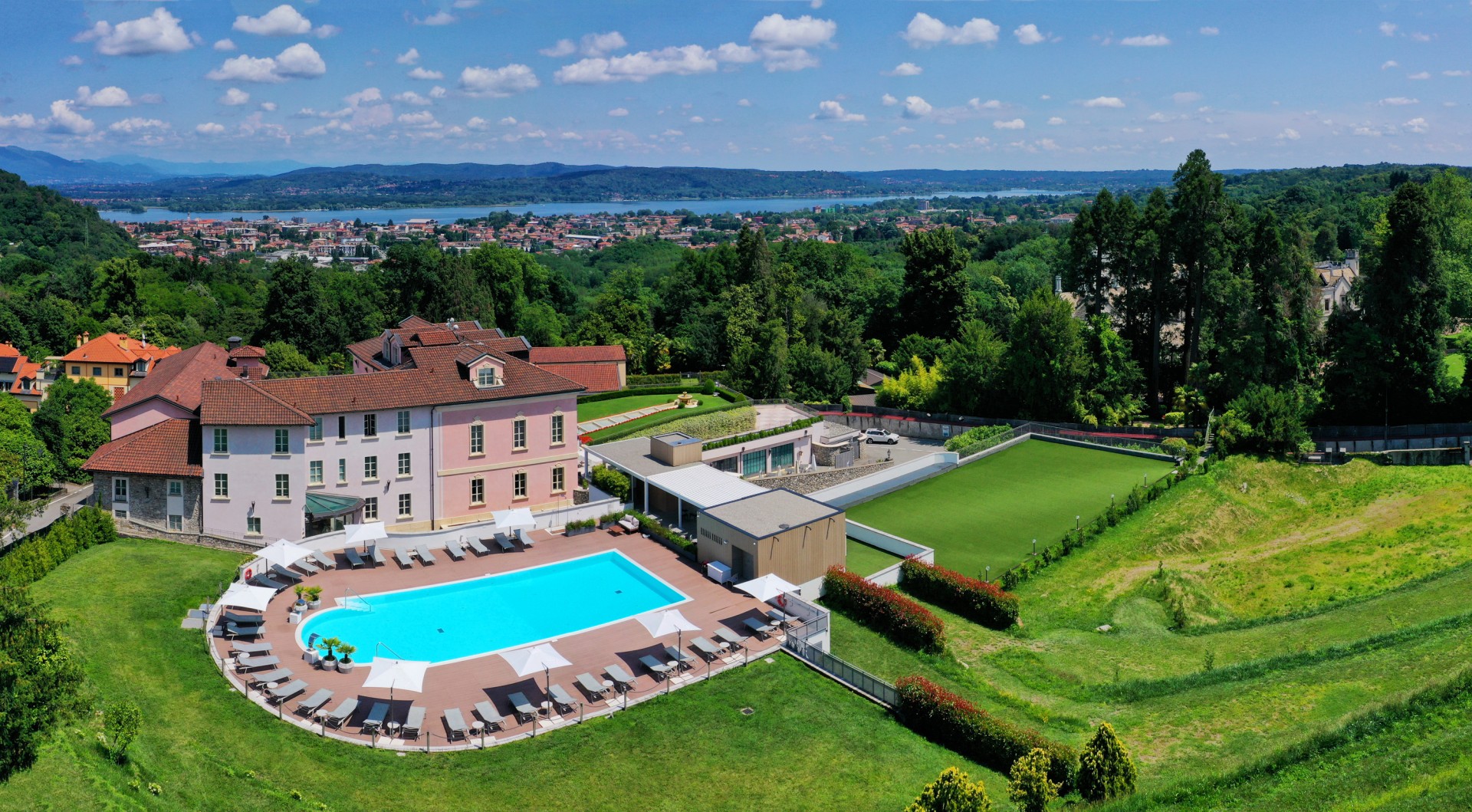 a pool and a building with a pool in the middle