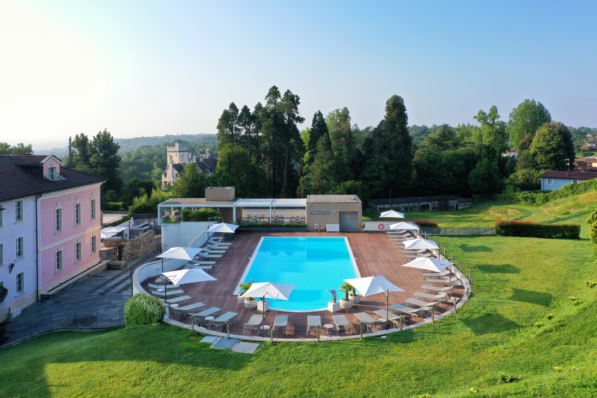 a pool with umbrellas and chairs around it