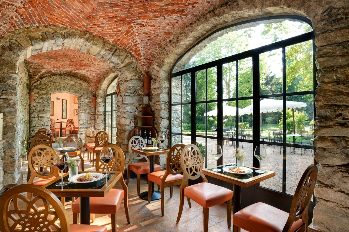 a restaurant with brick walls and tables and chairs