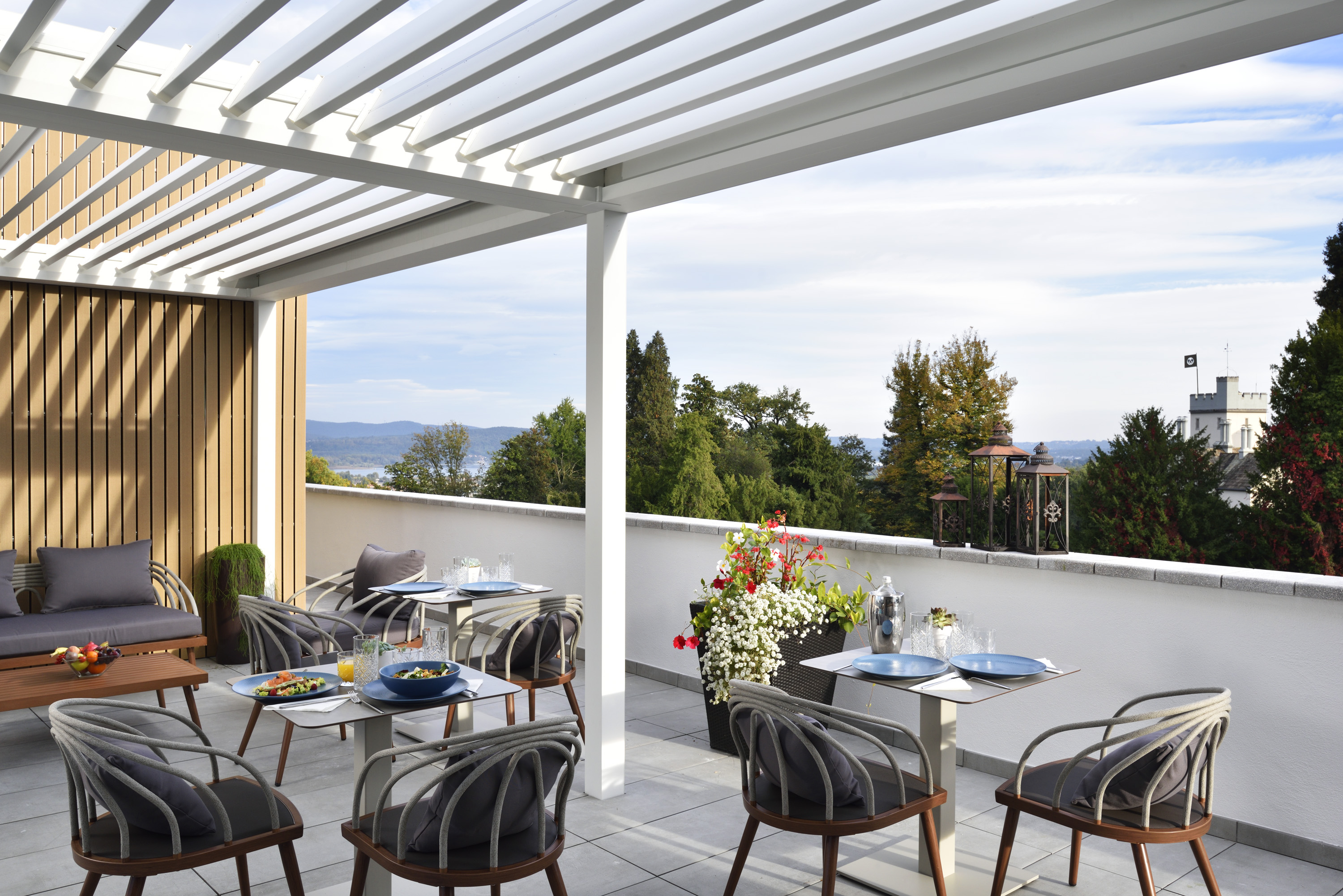 a patio with tables and chairs