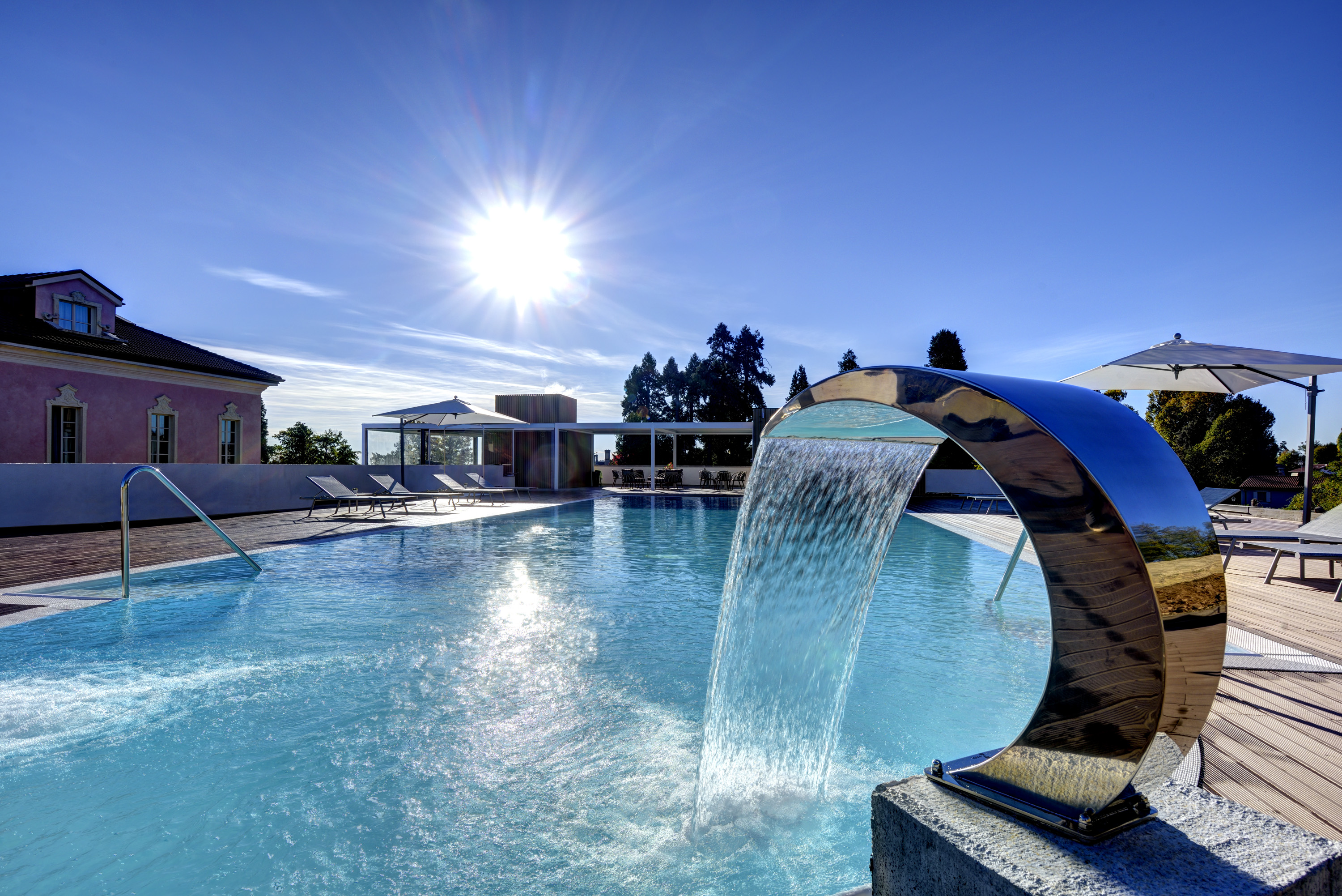 a pool with a waterfall