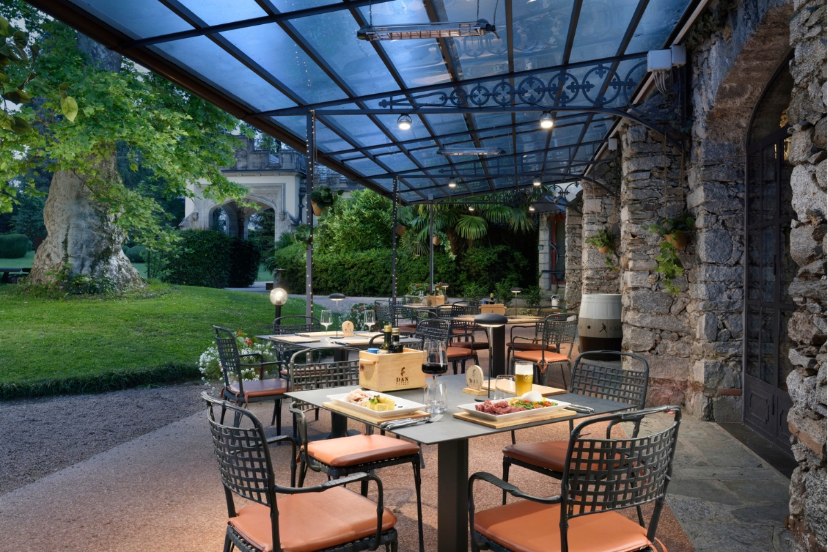 a table and chairs under a covered patio