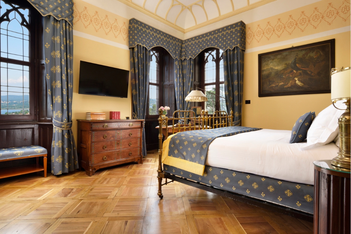 a bedroom with a bed and a dresser
