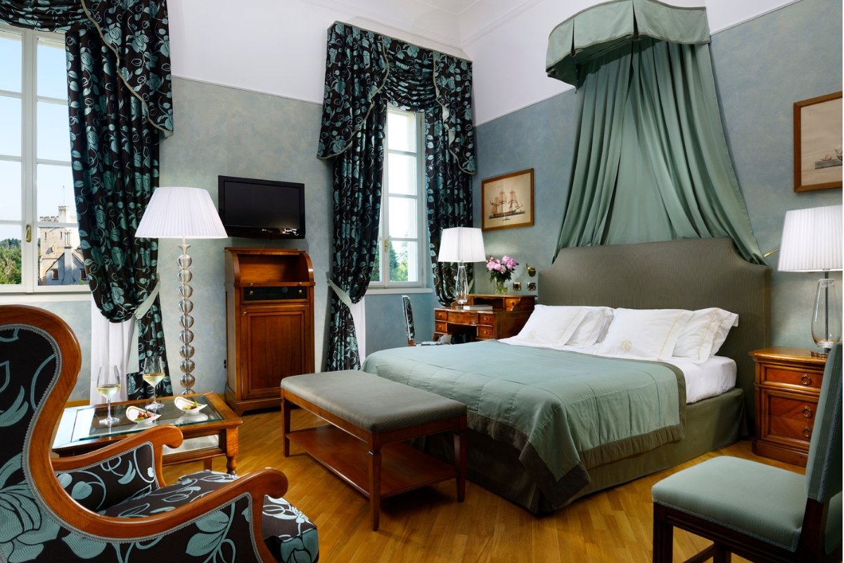 a room with a bed and a television