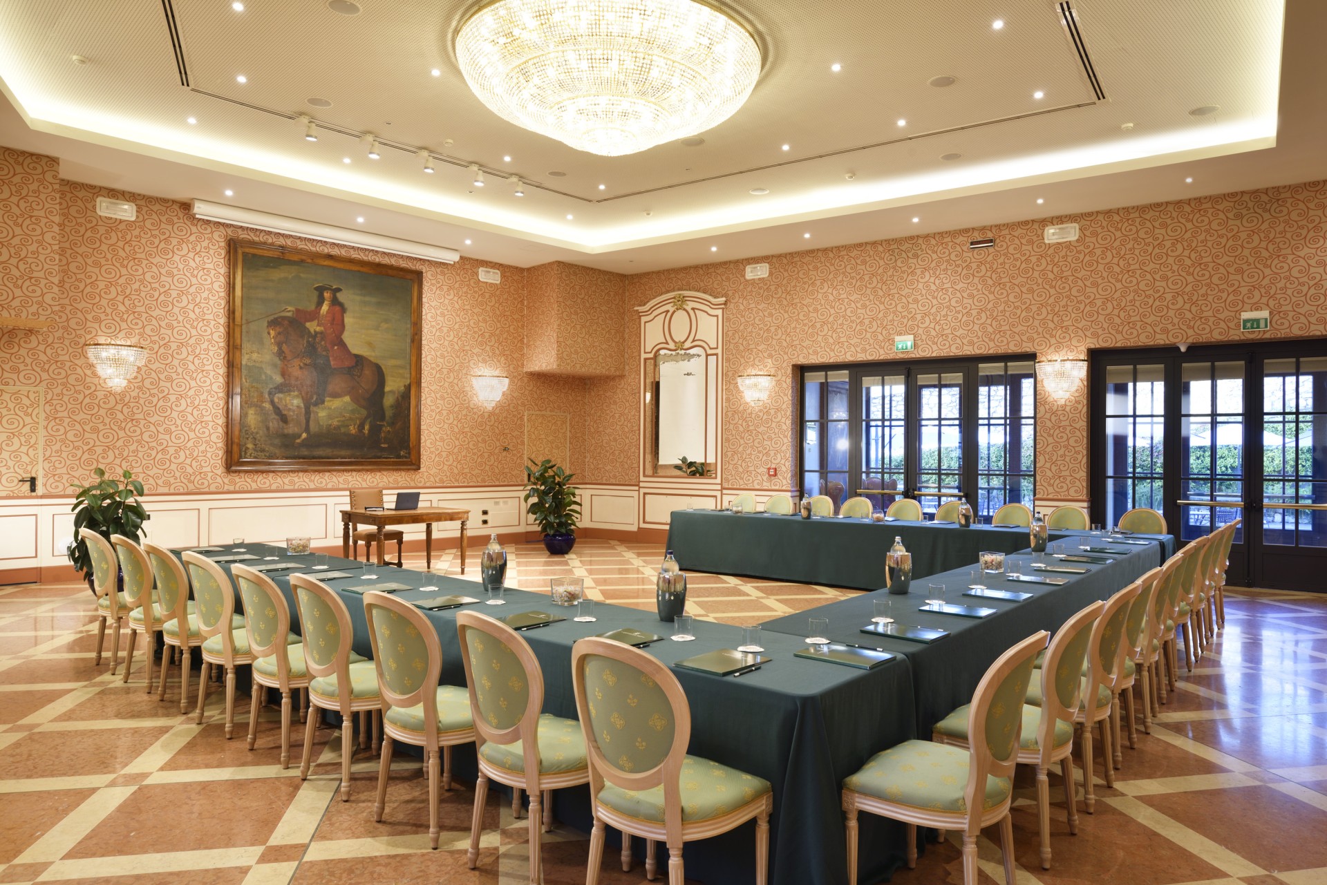 a room with a large table and chairs