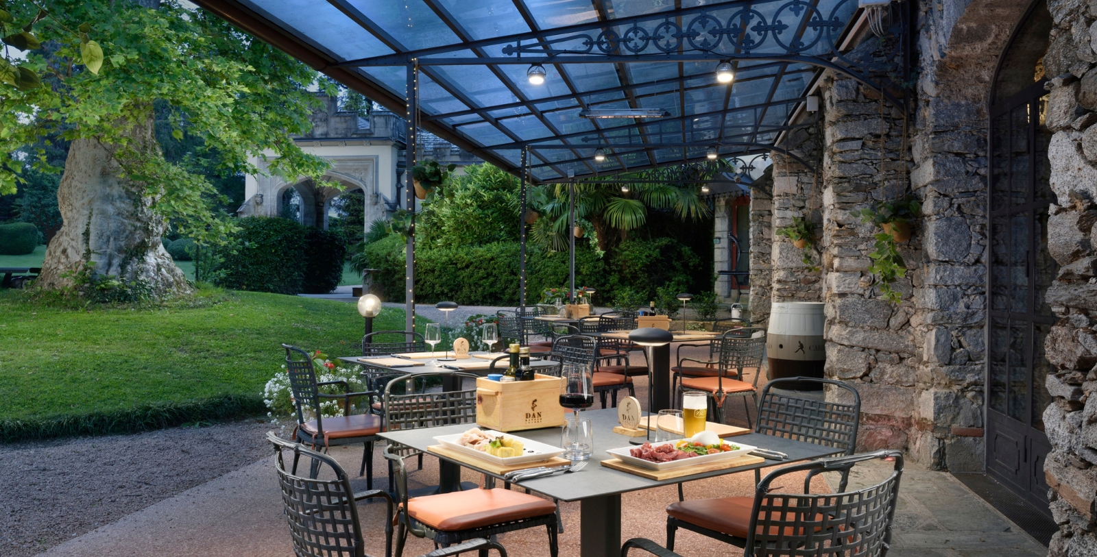 a table and chairs under a covered patio
