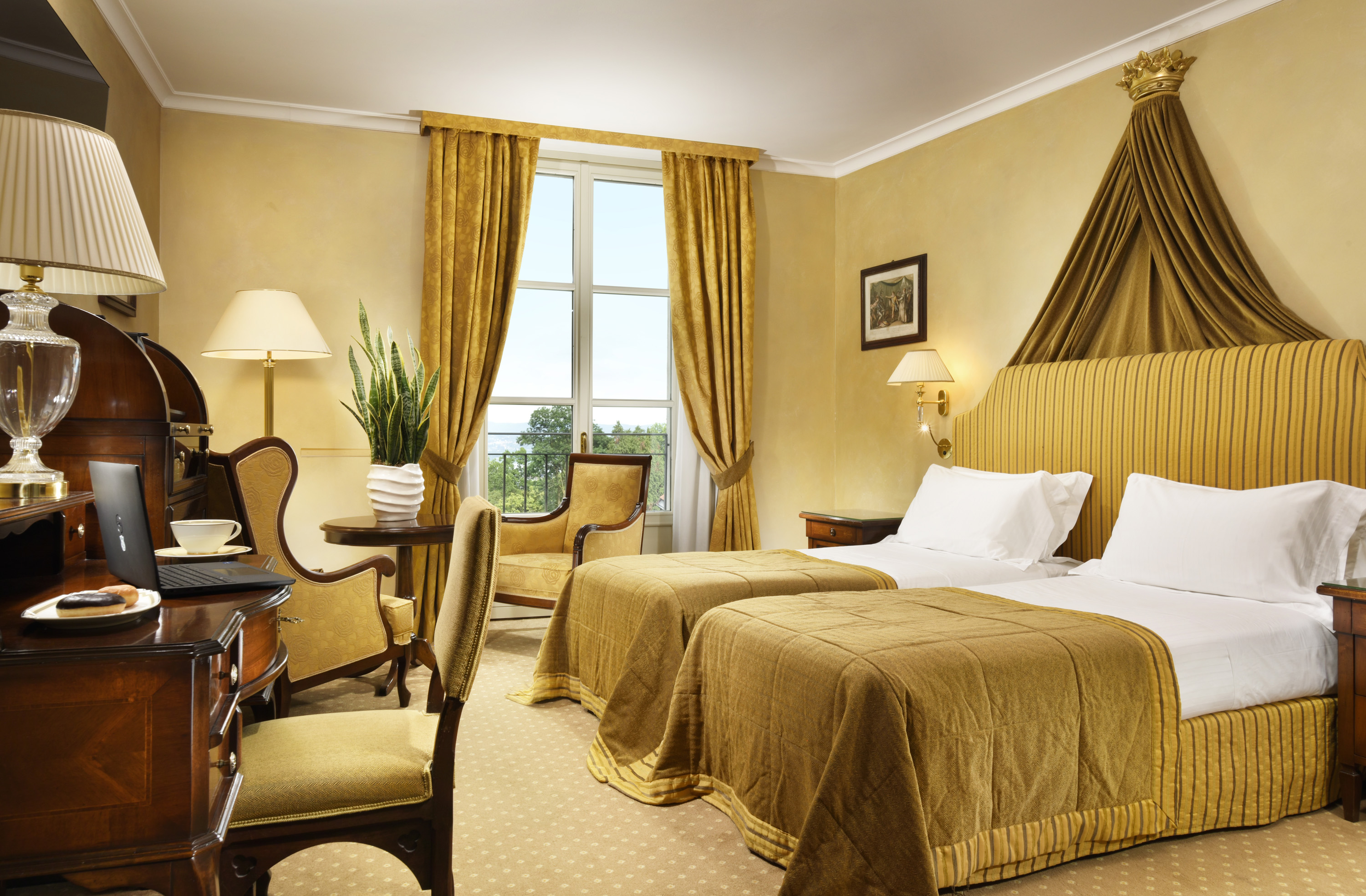 a room with two beds and a desk