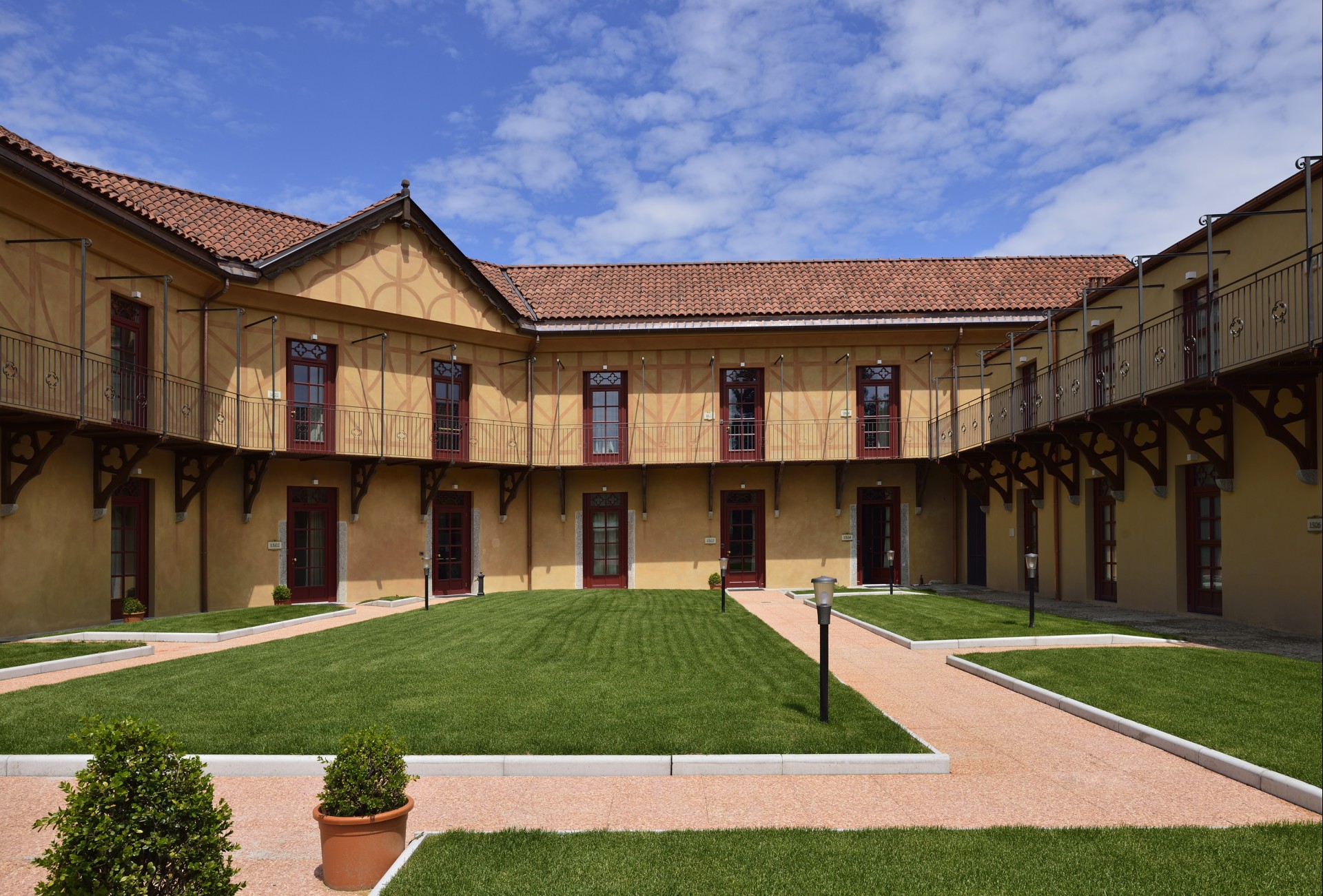a building with a lawn and a walkway