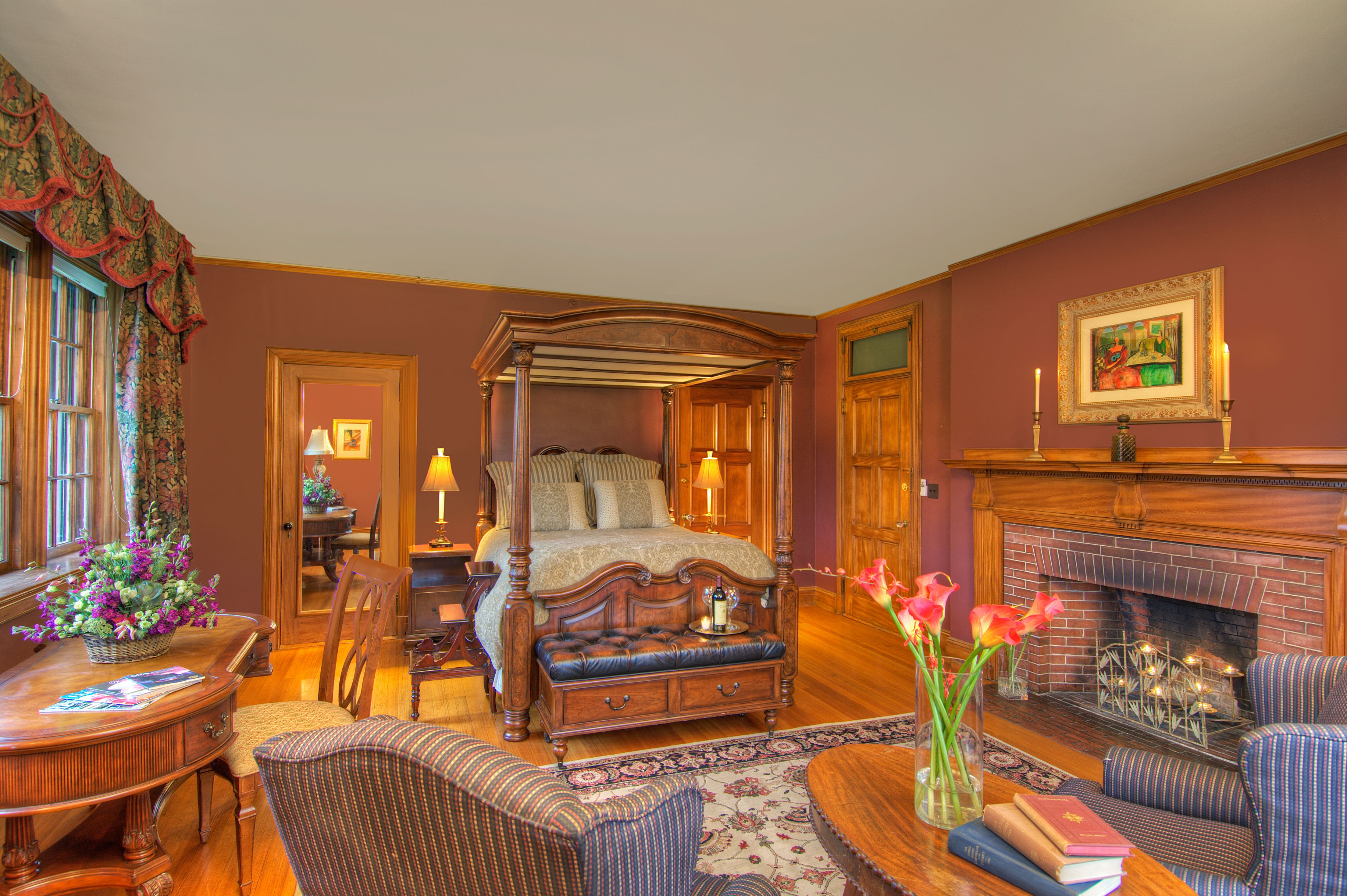 a room with a bed and a fireplace