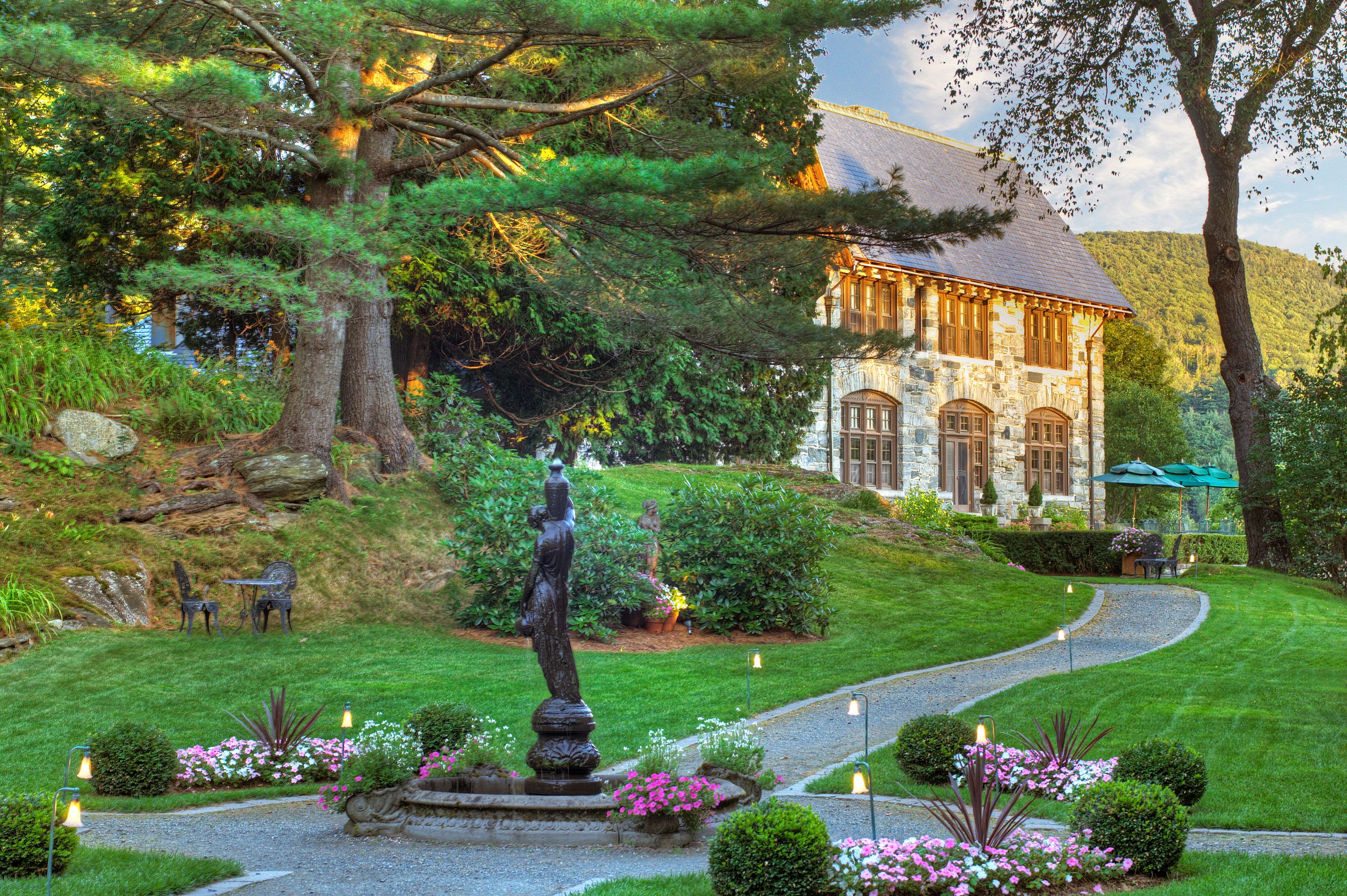 a stone building with a fountain in front of it
