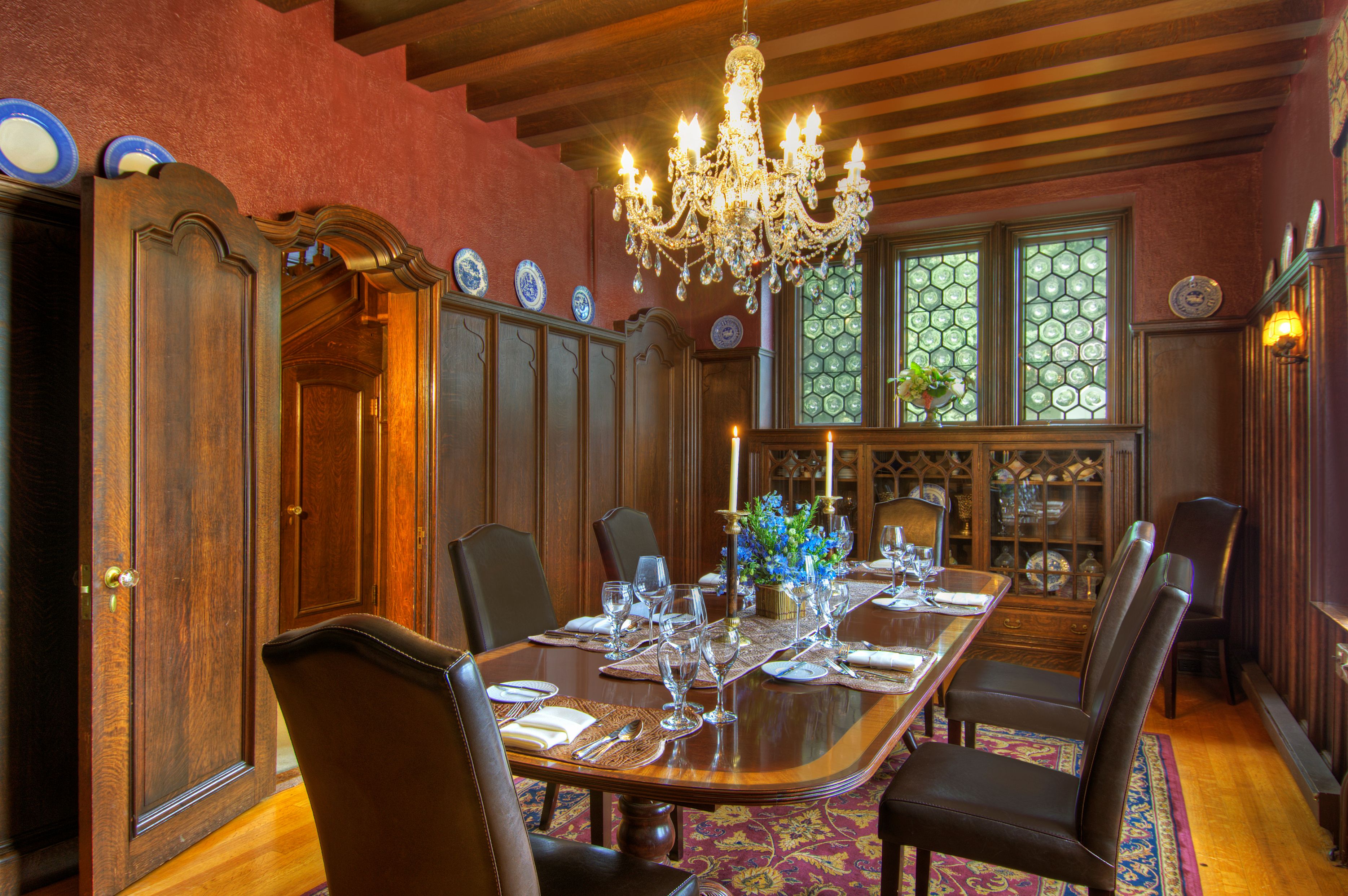 a dining room with a chandelier and a table