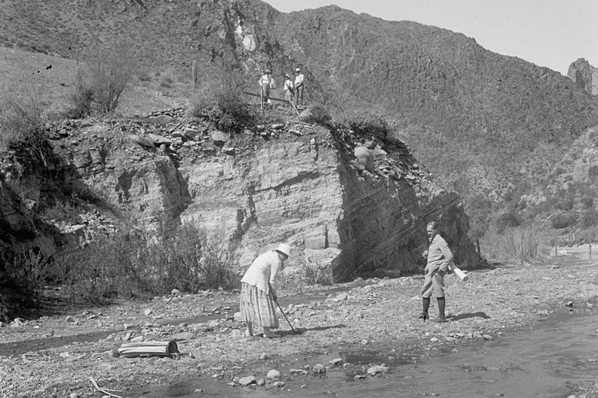 a group of people on a rocky shore