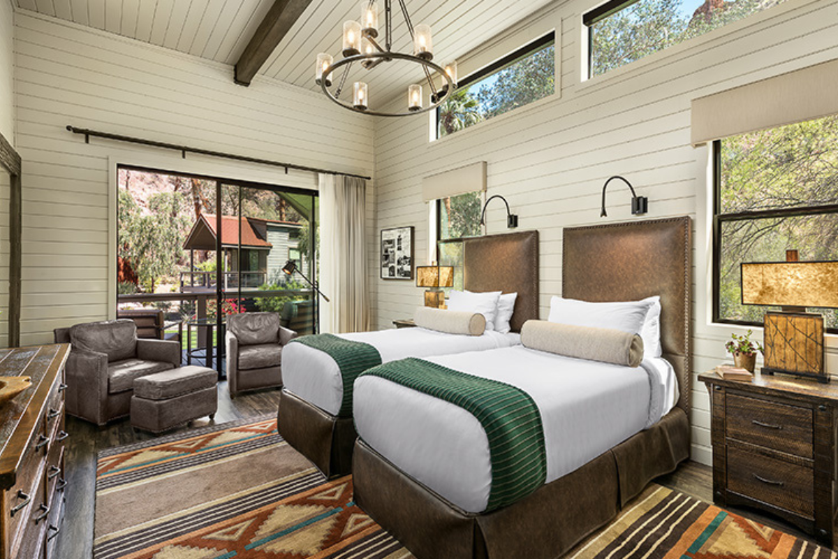 a room with two beds and a couch