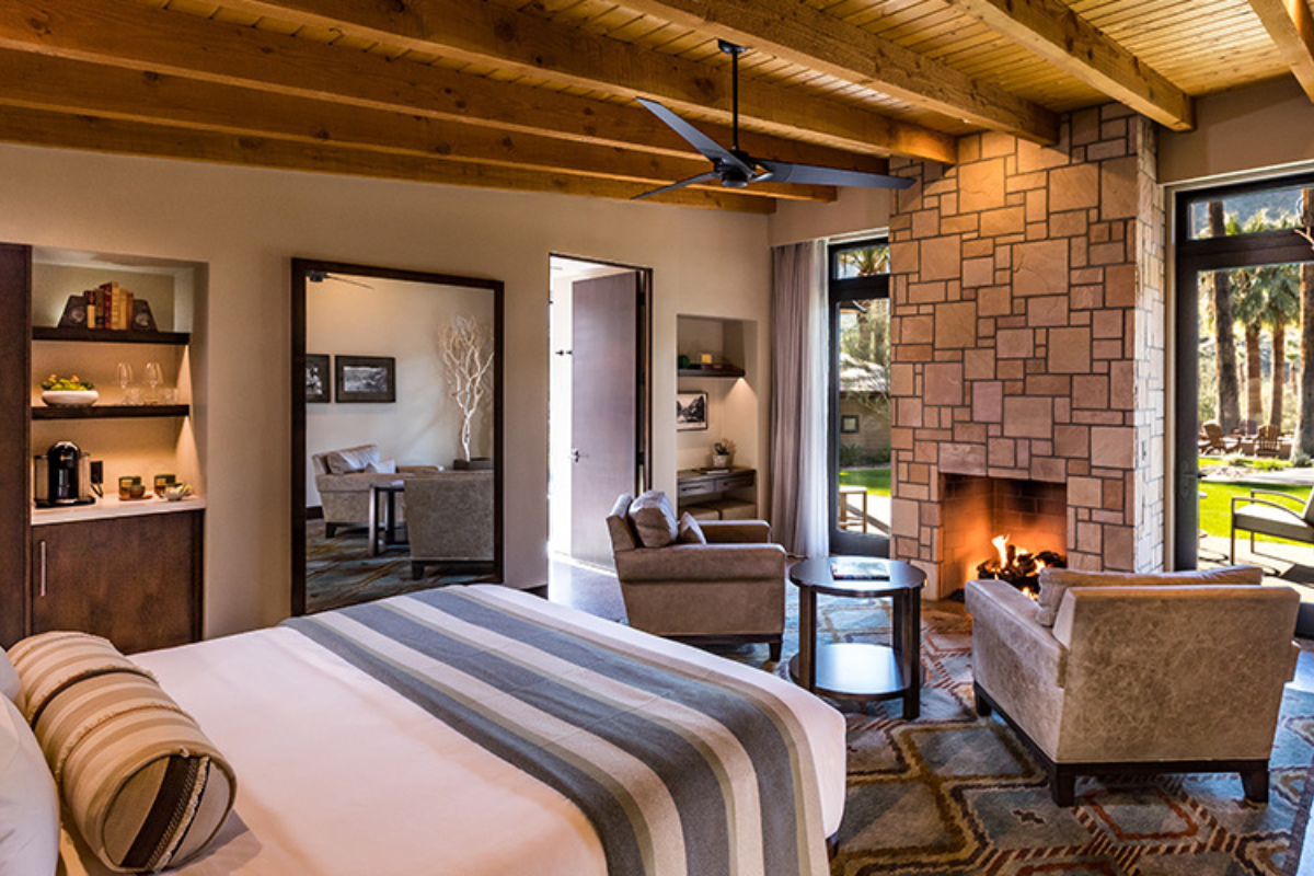 a room with a fireplace and a bed