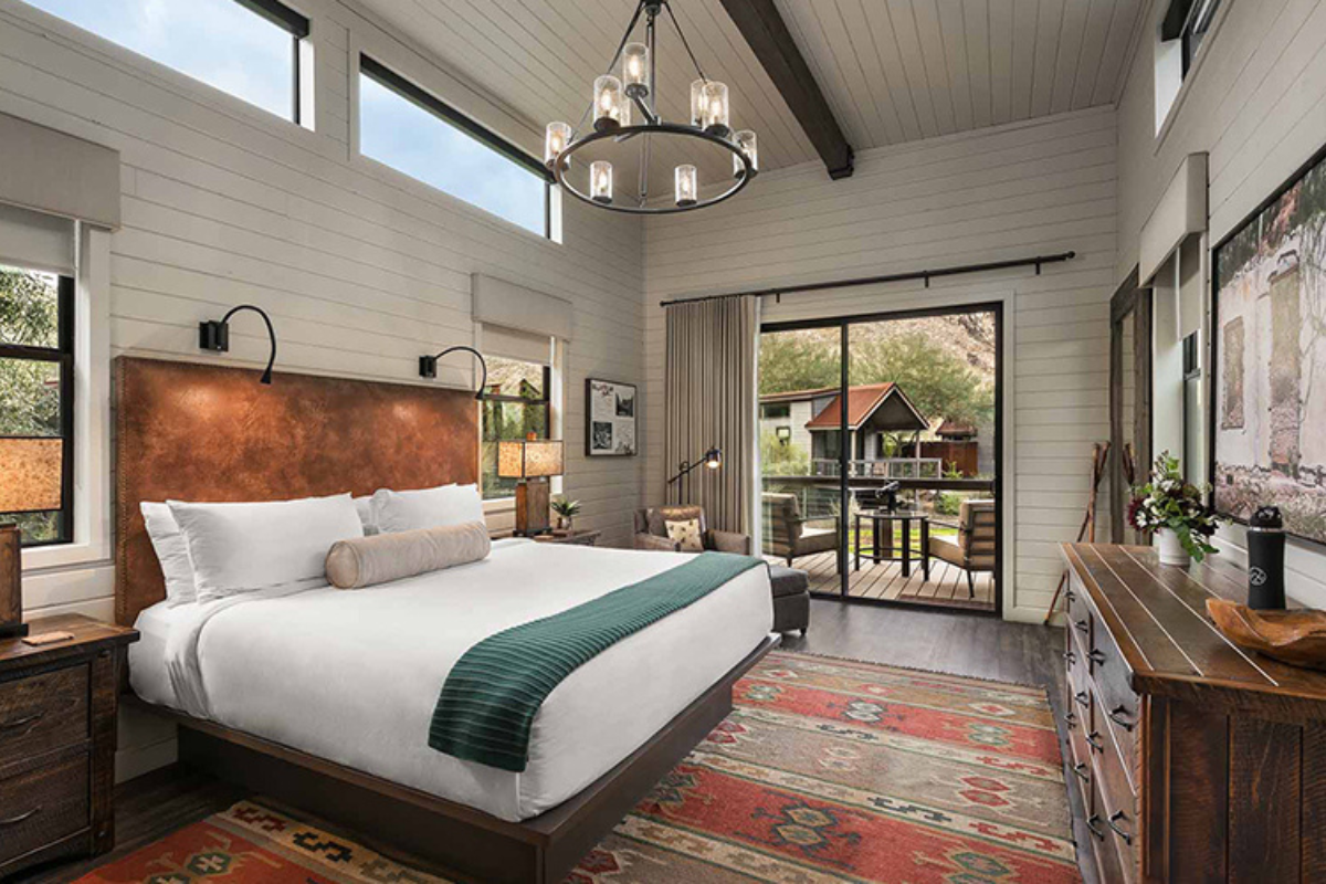 a room with a bed and a rug