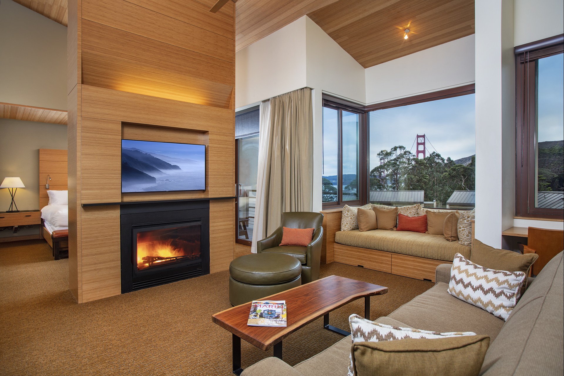 a living room with a fireplace and couches