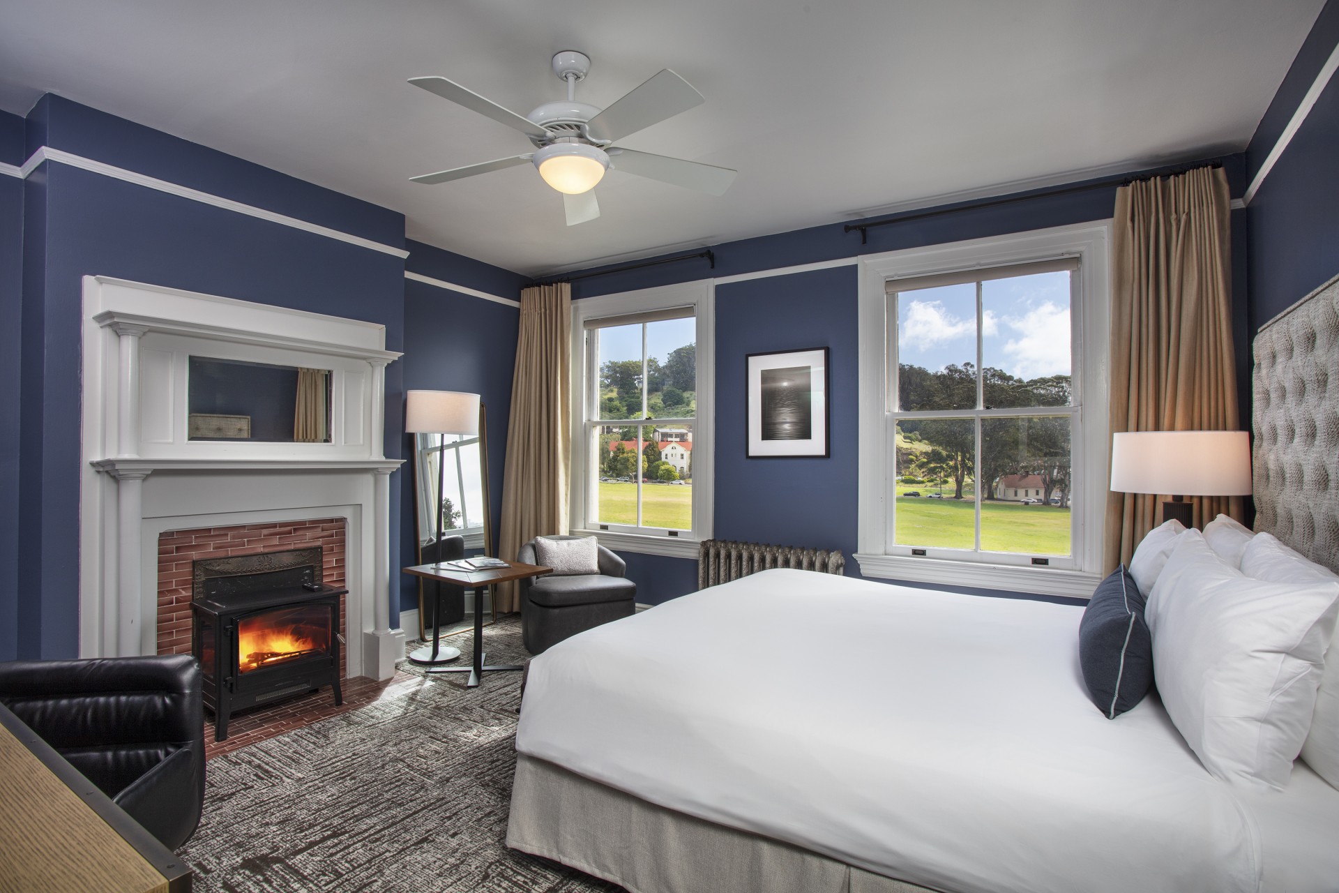 a bedroom with a fireplace and a bed