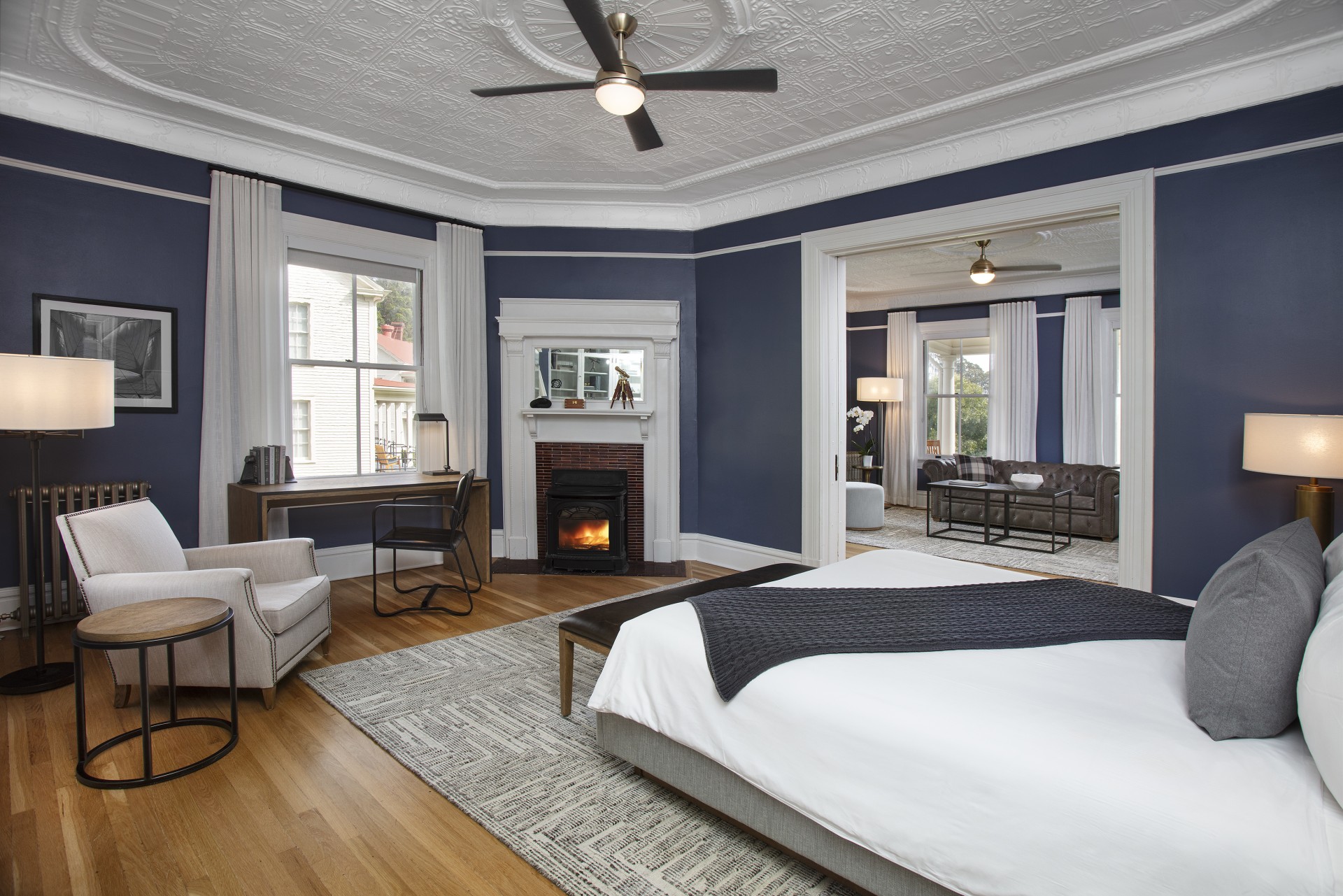 a room with a fireplace and a bed