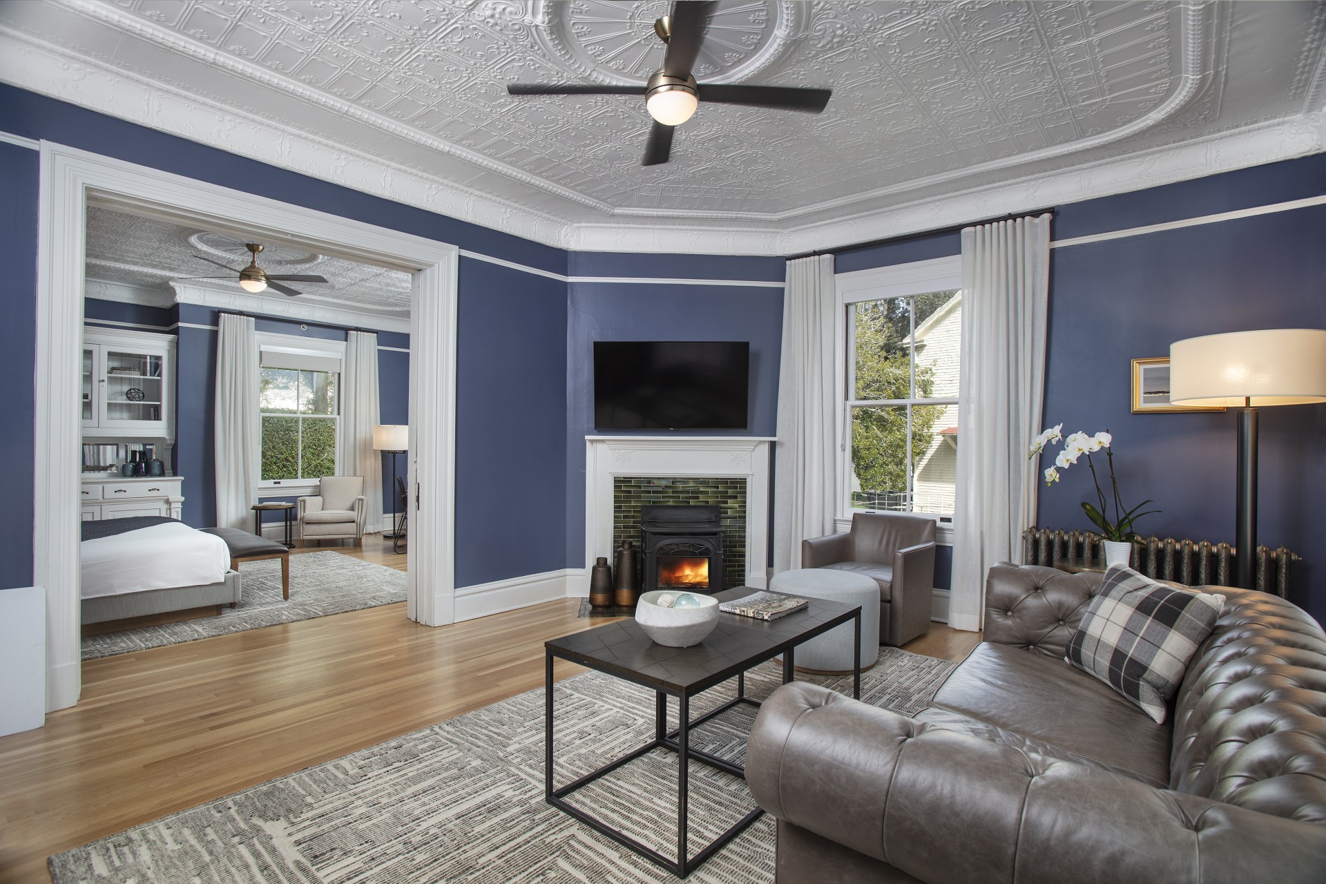 a living room with a fireplace and a couch