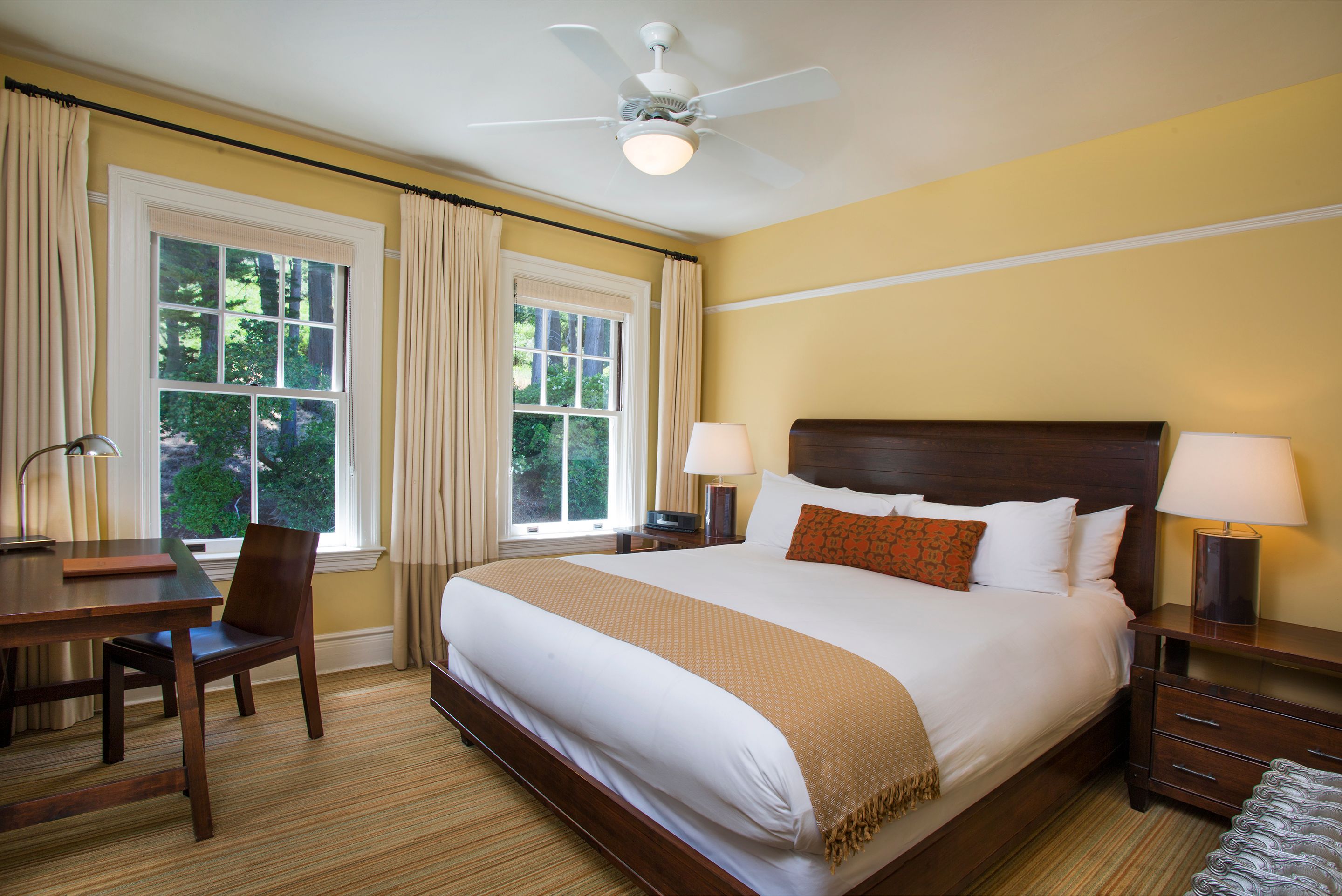 a bedroom with a bed and a chair