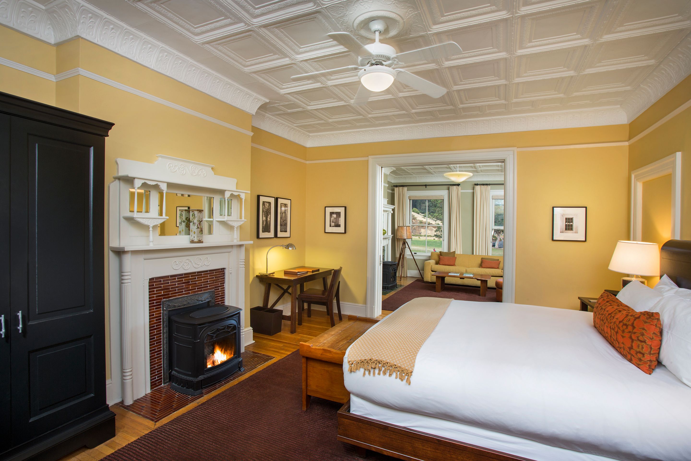 a room with a fireplace and a bed