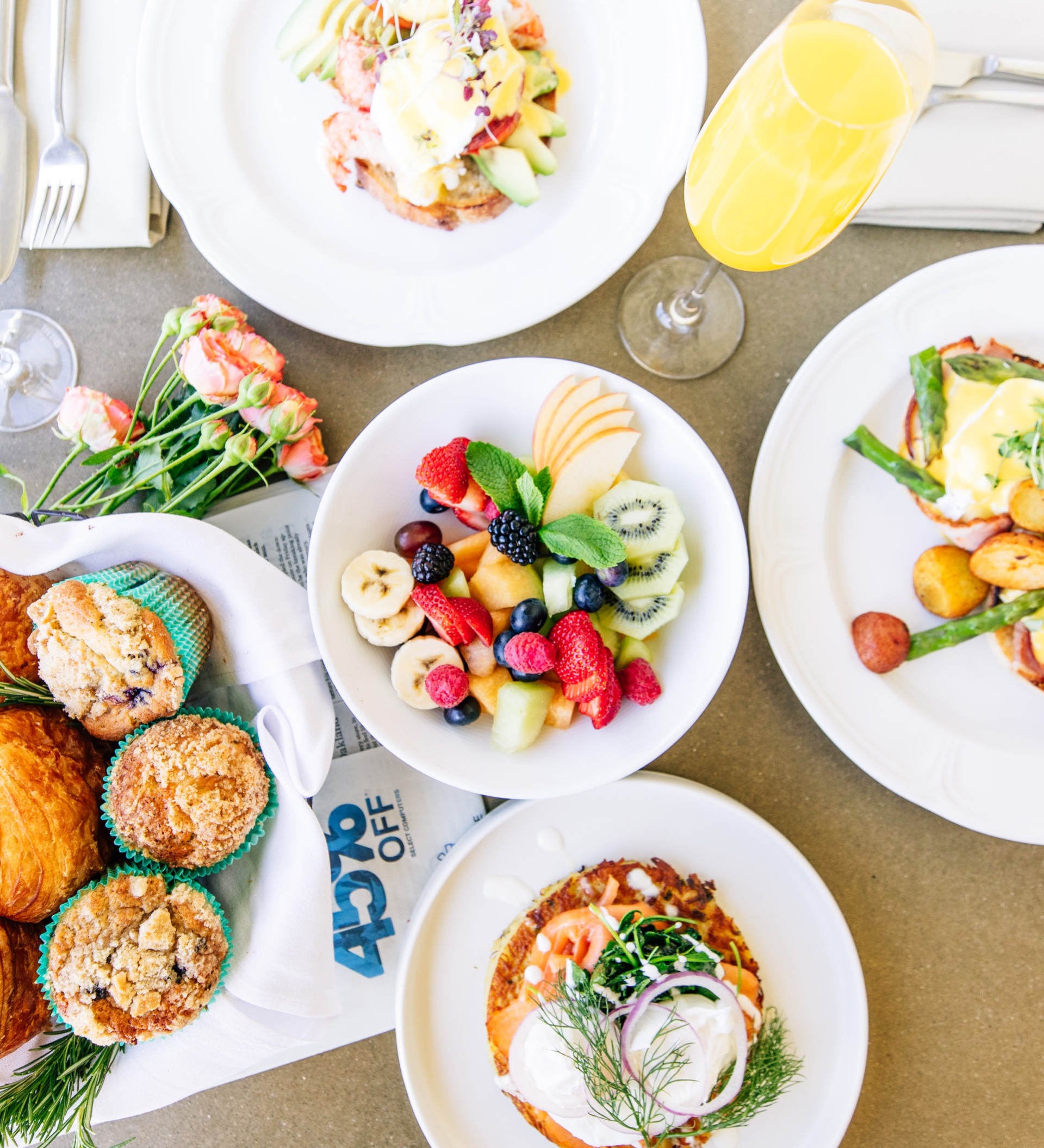 a table with plates of food and drinks