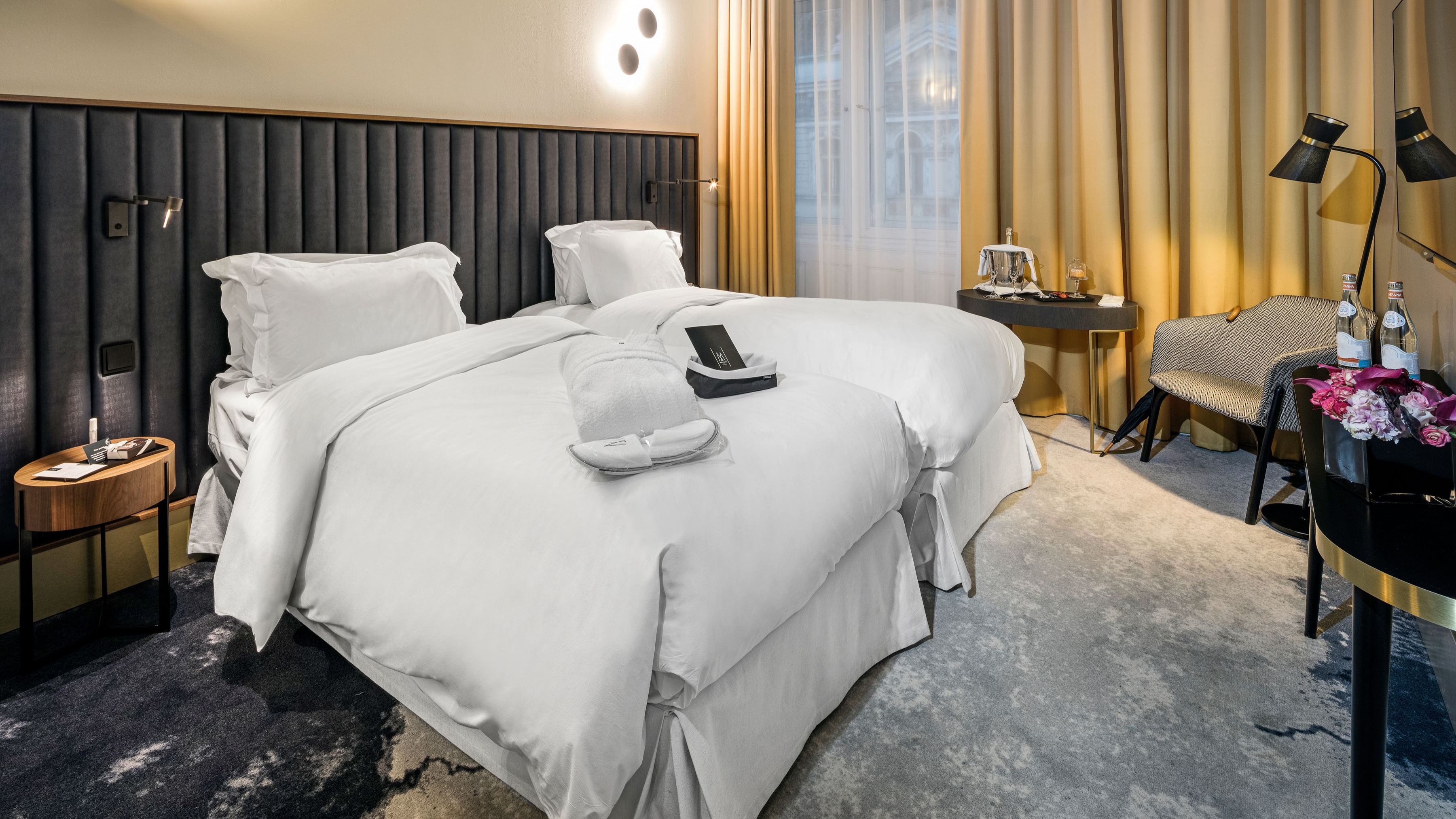 a hotel room with a bed and a table