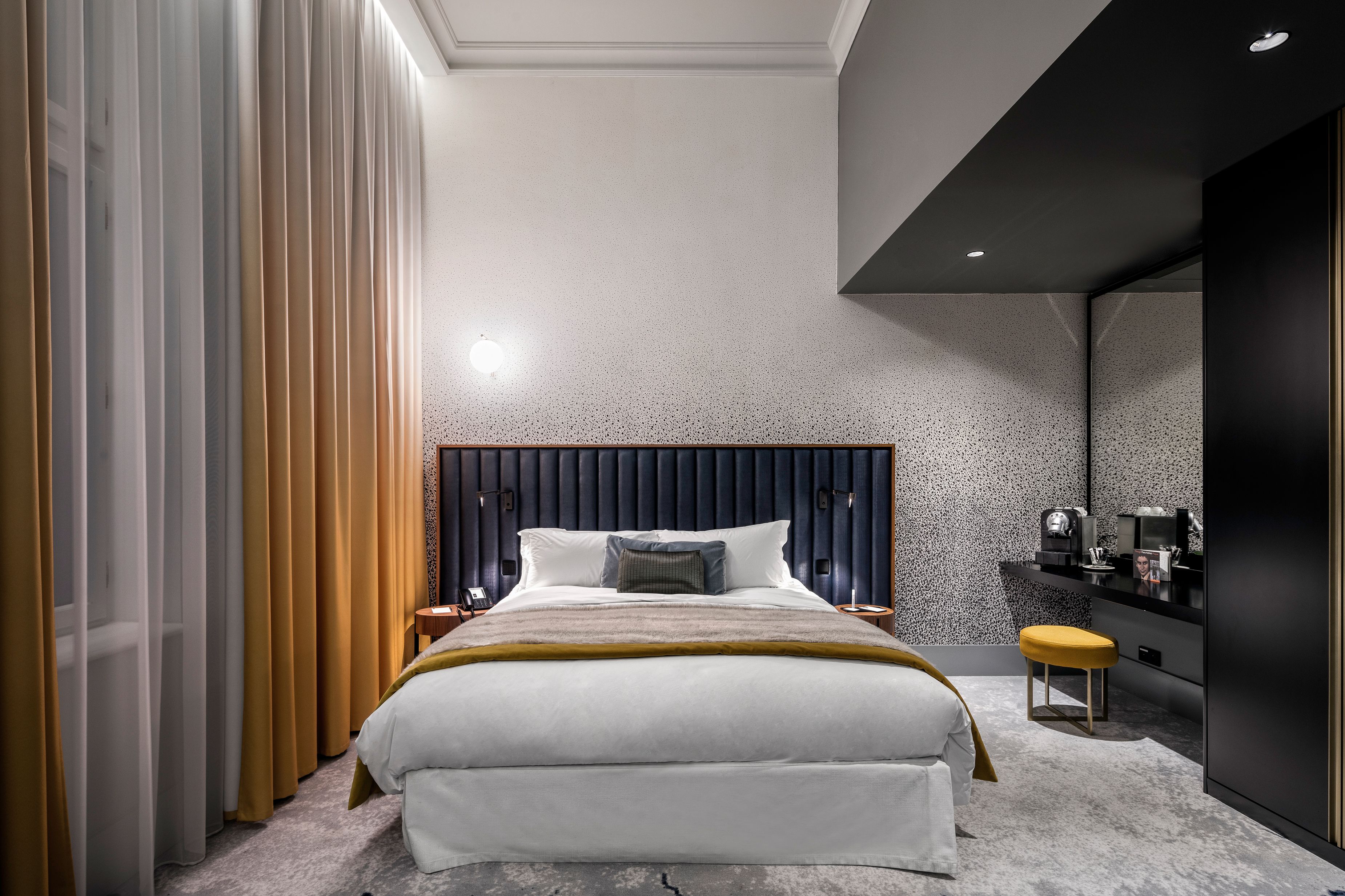 a room with a bed and a desk