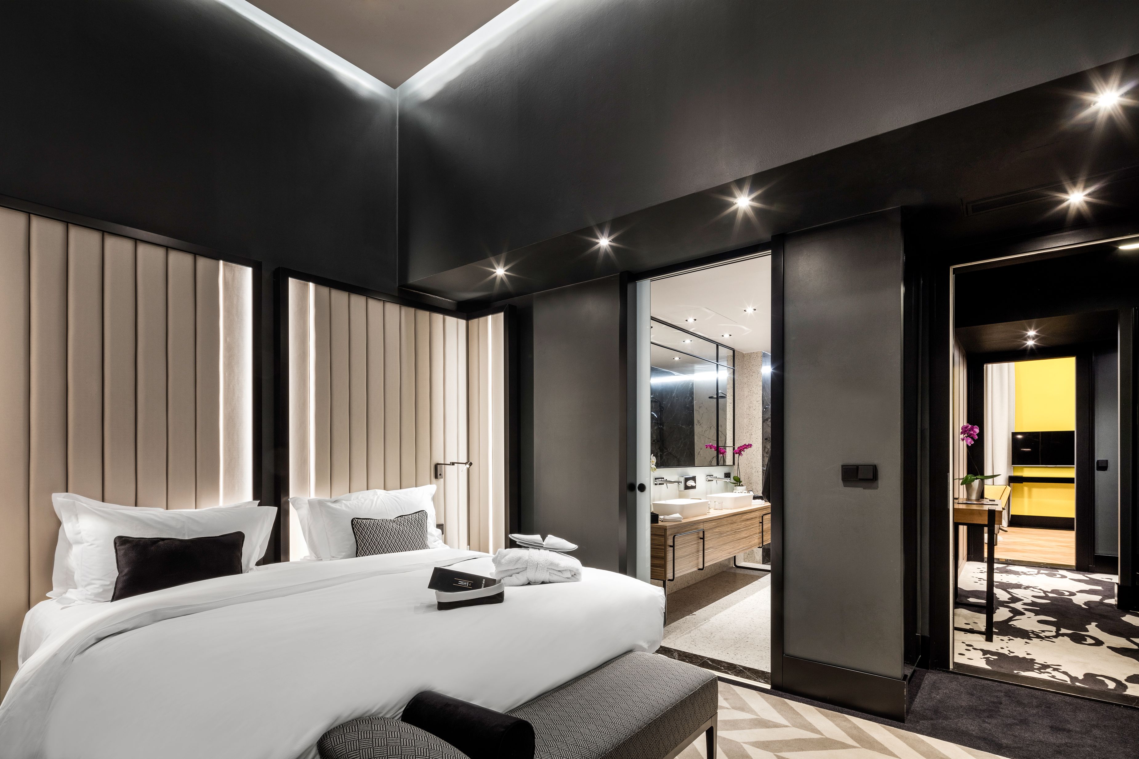 a bedroom with a bed and a mirror