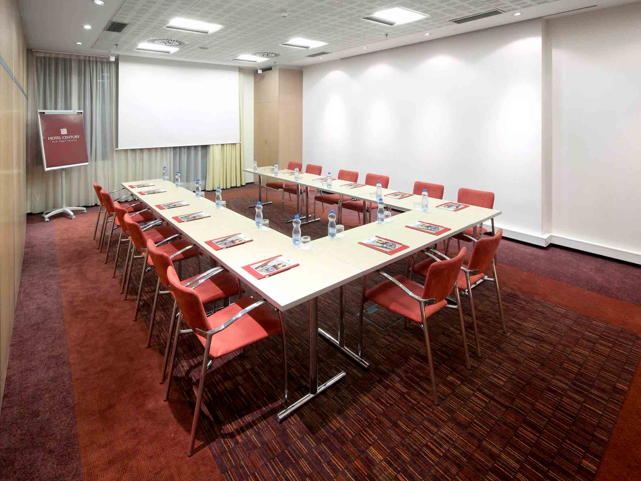 a conference room with a table and chairs
