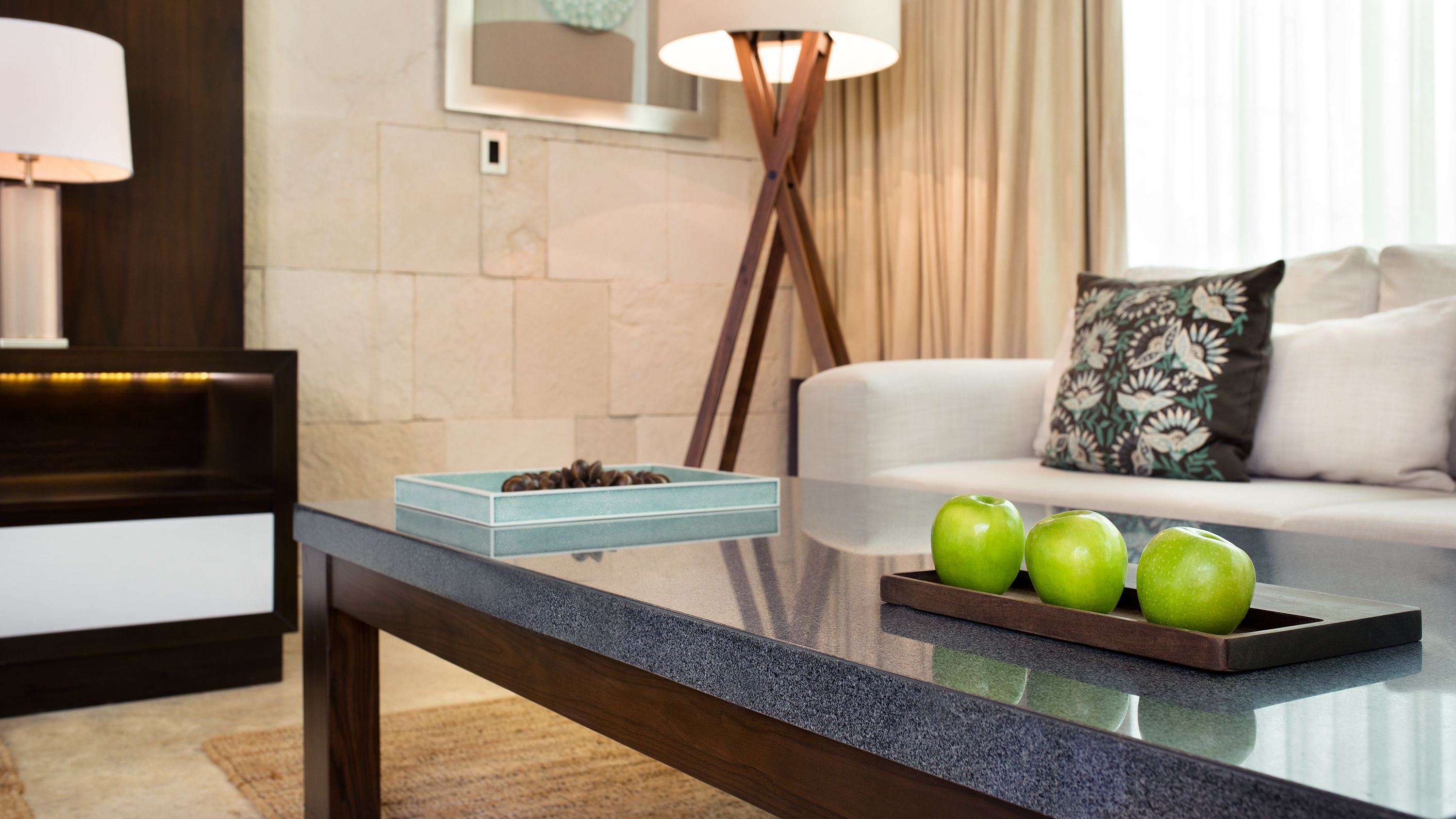 a table with two apples on it