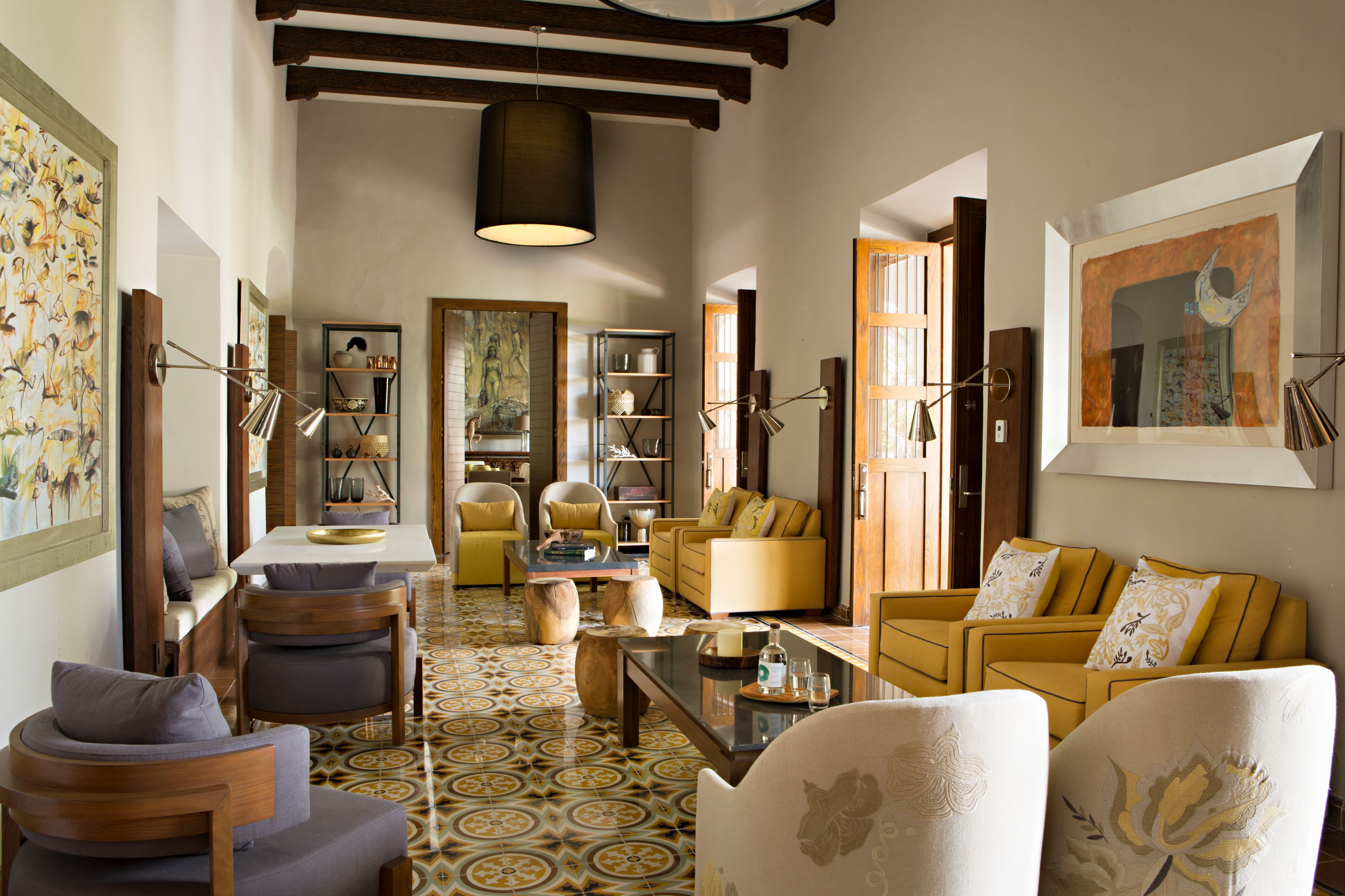 a room with furniture and art on the wall