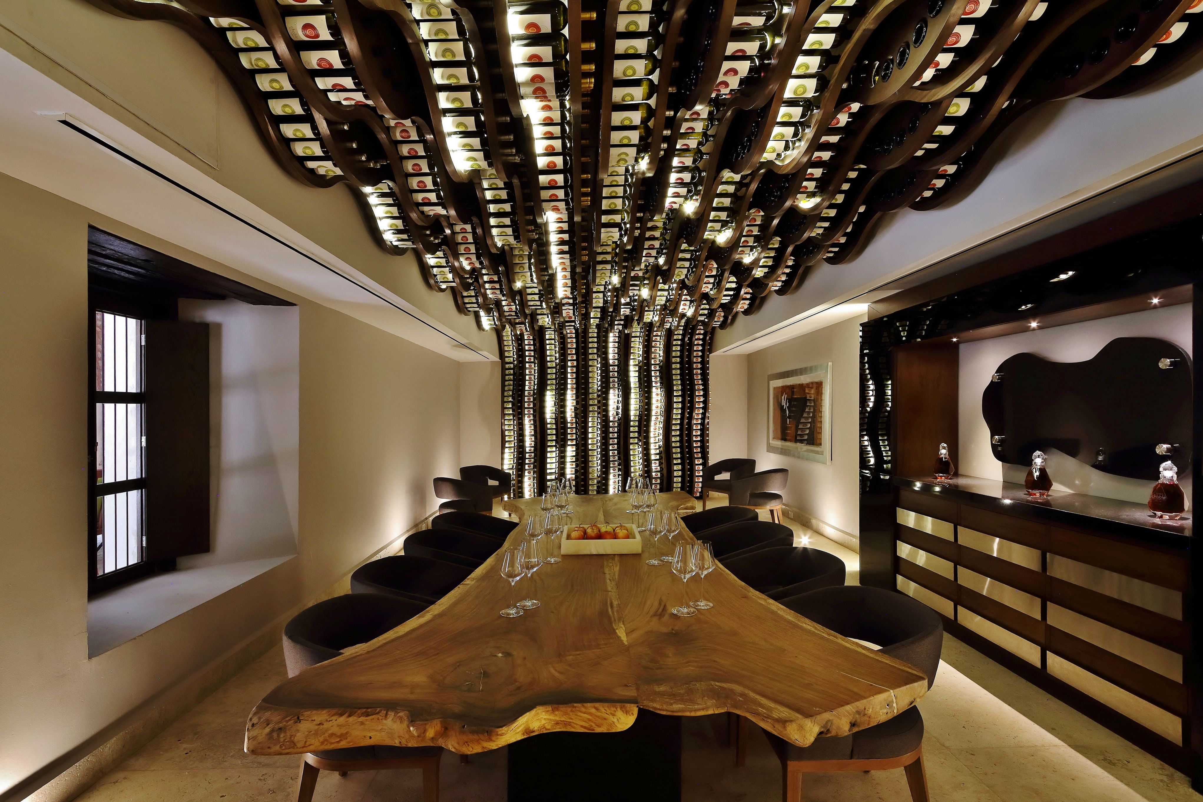 a room with a large table and chairs