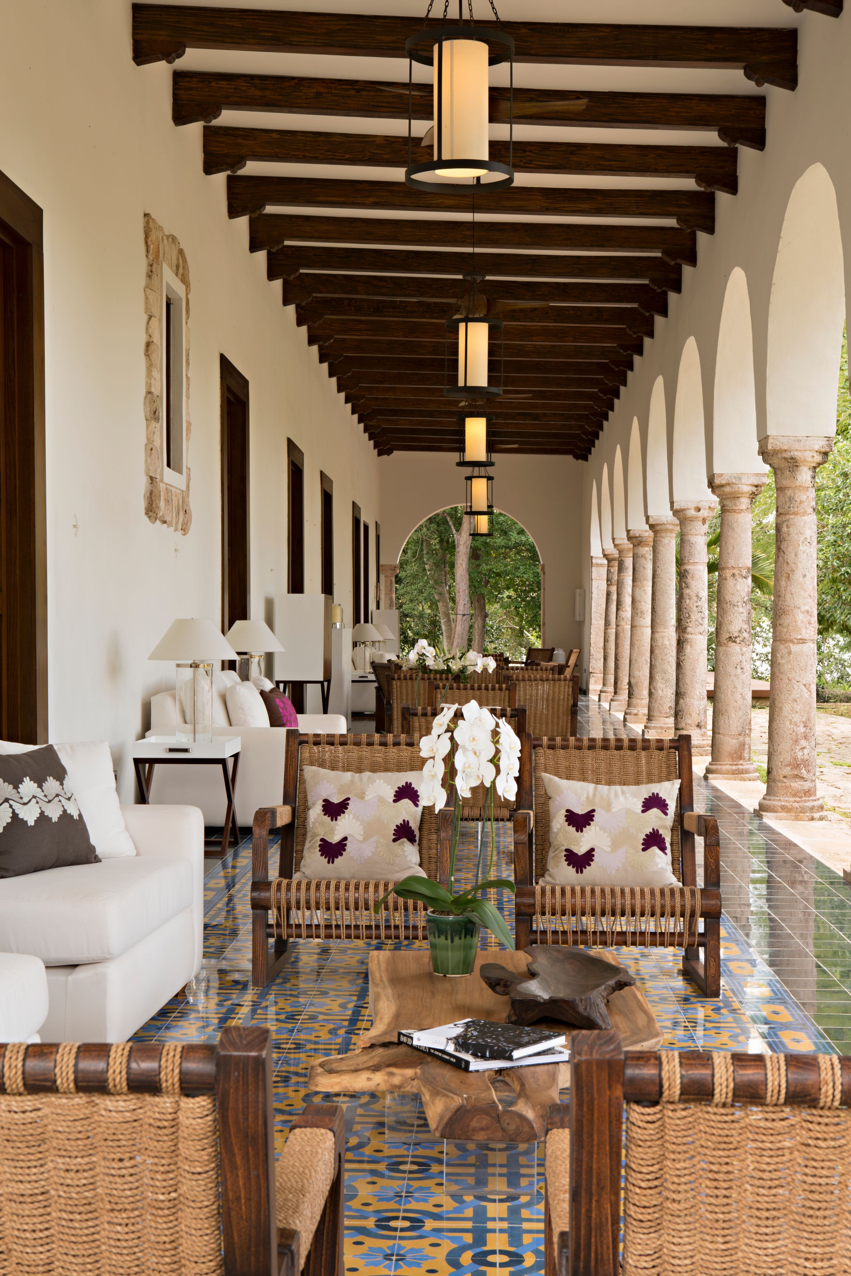 a room with white furniture and a tile floor