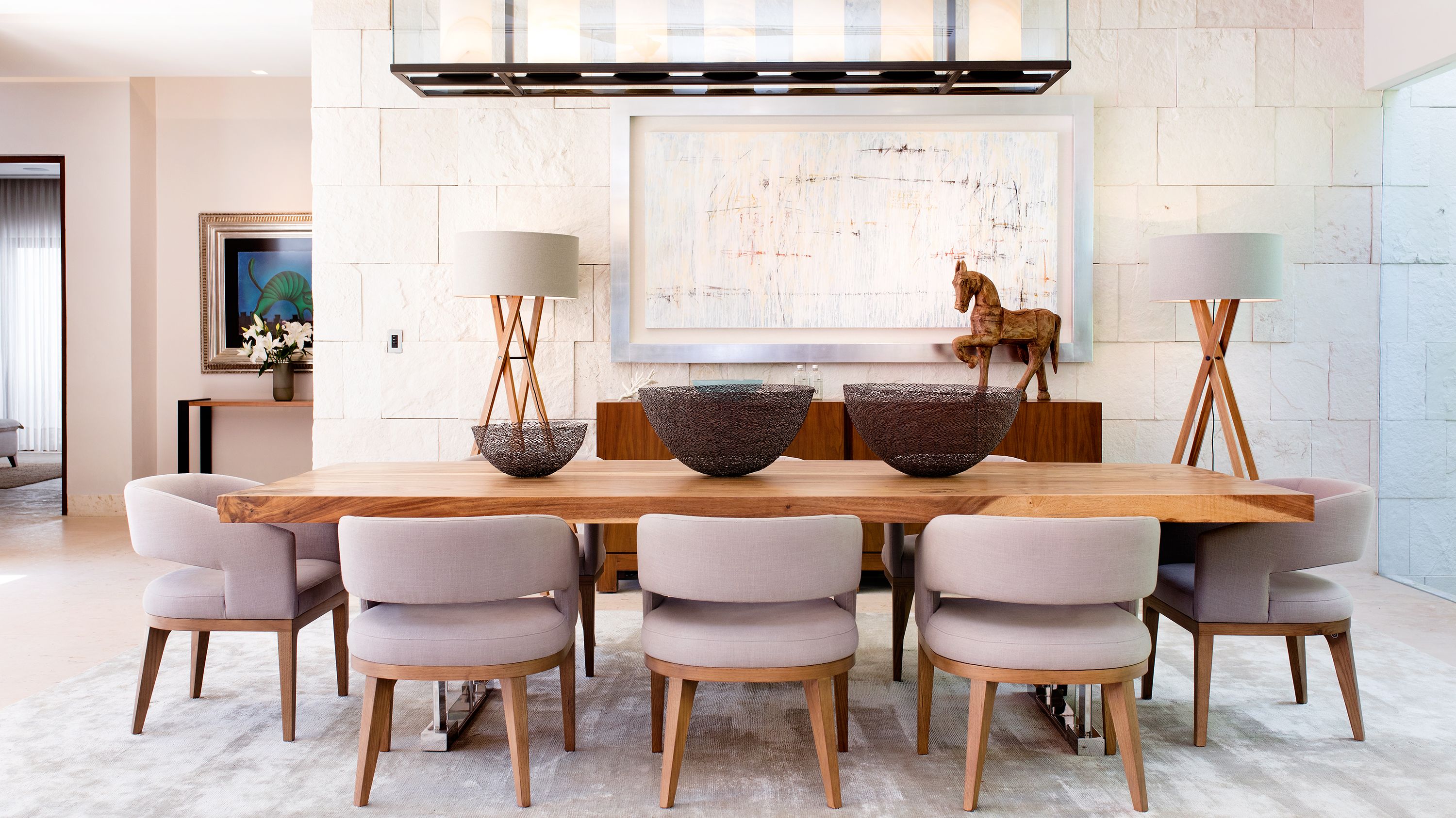 a dining room with a table and chairs