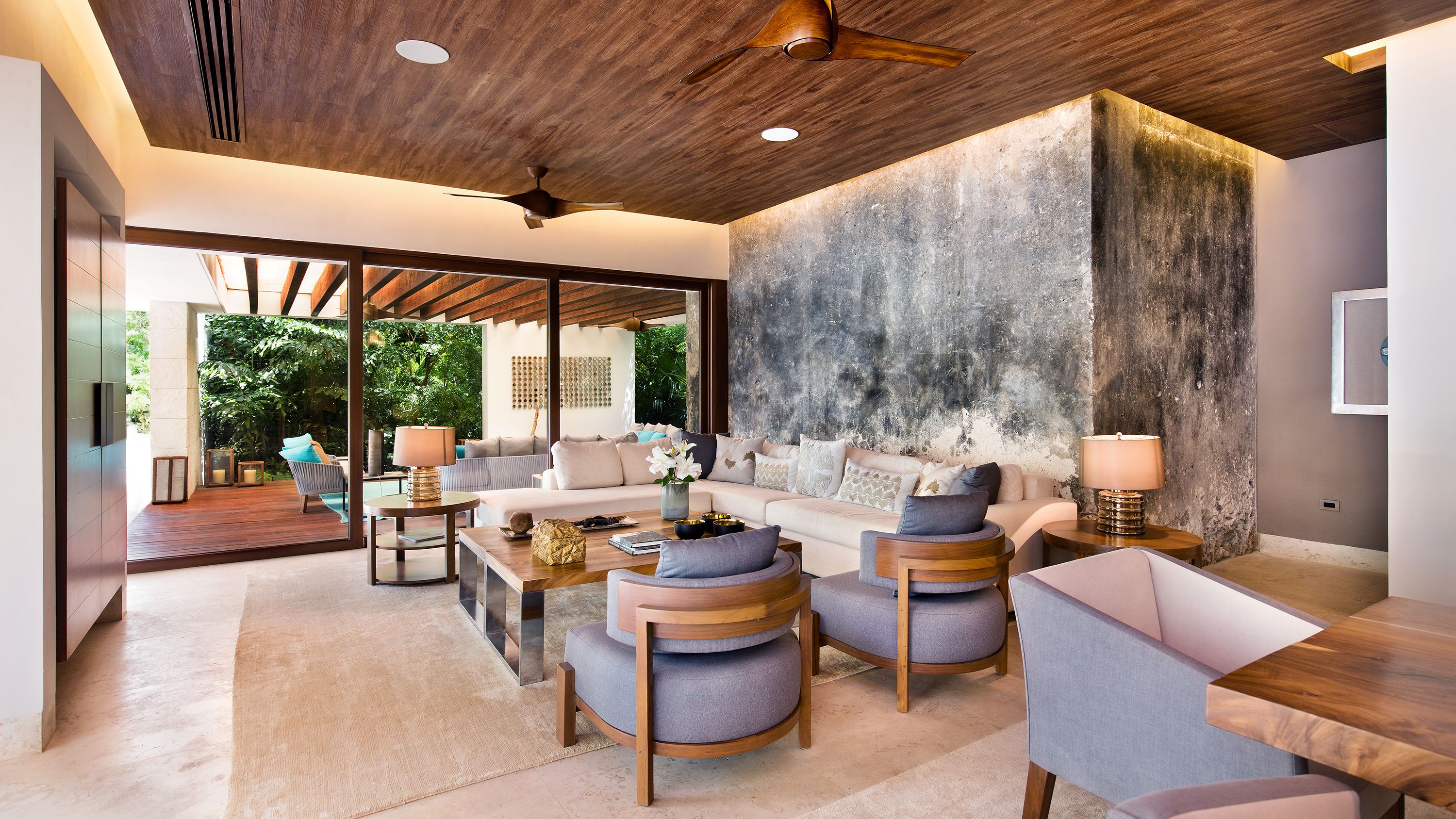 a living room with a couch and chairs