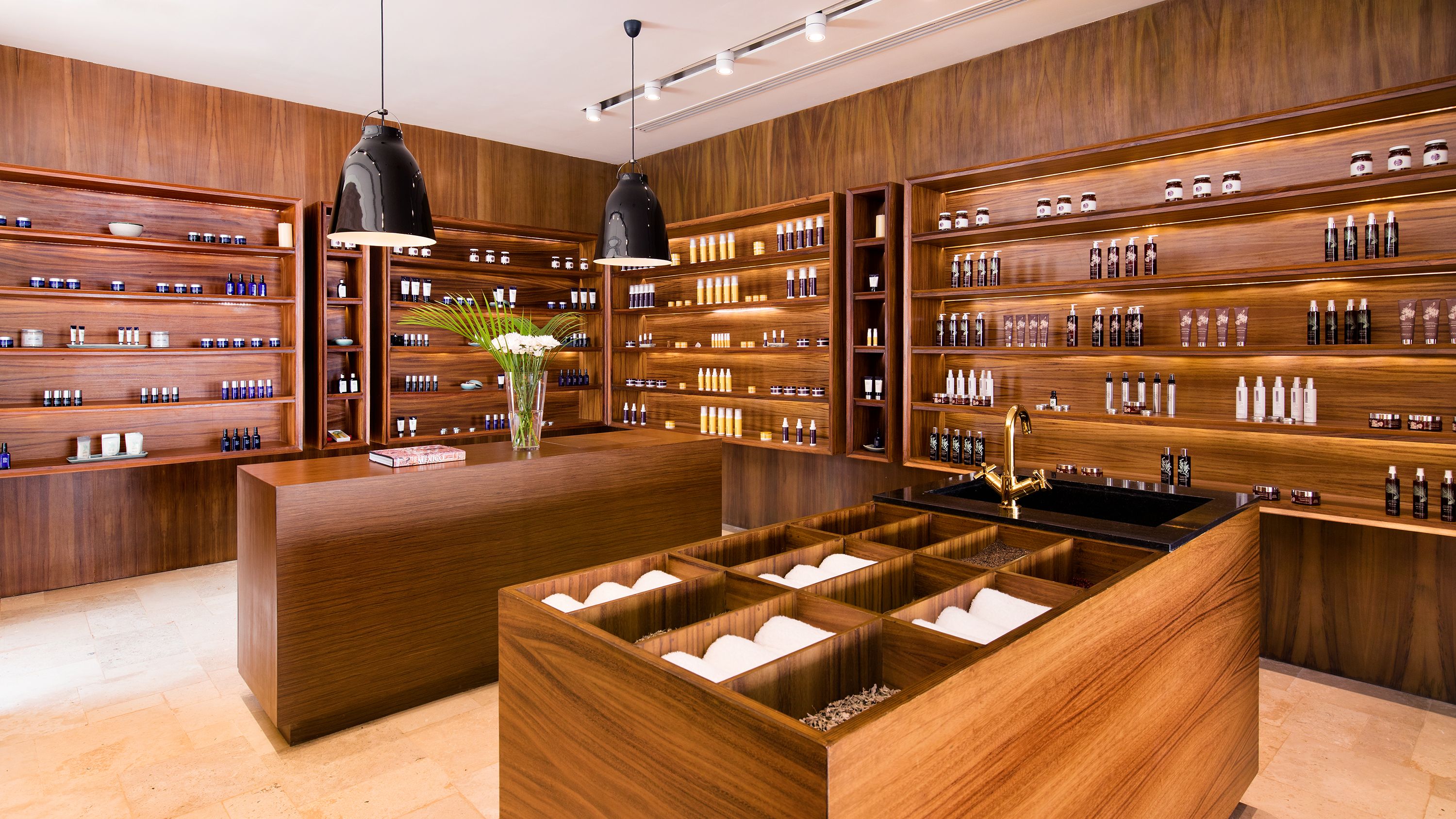 a room with shelves and shelves of essential oils