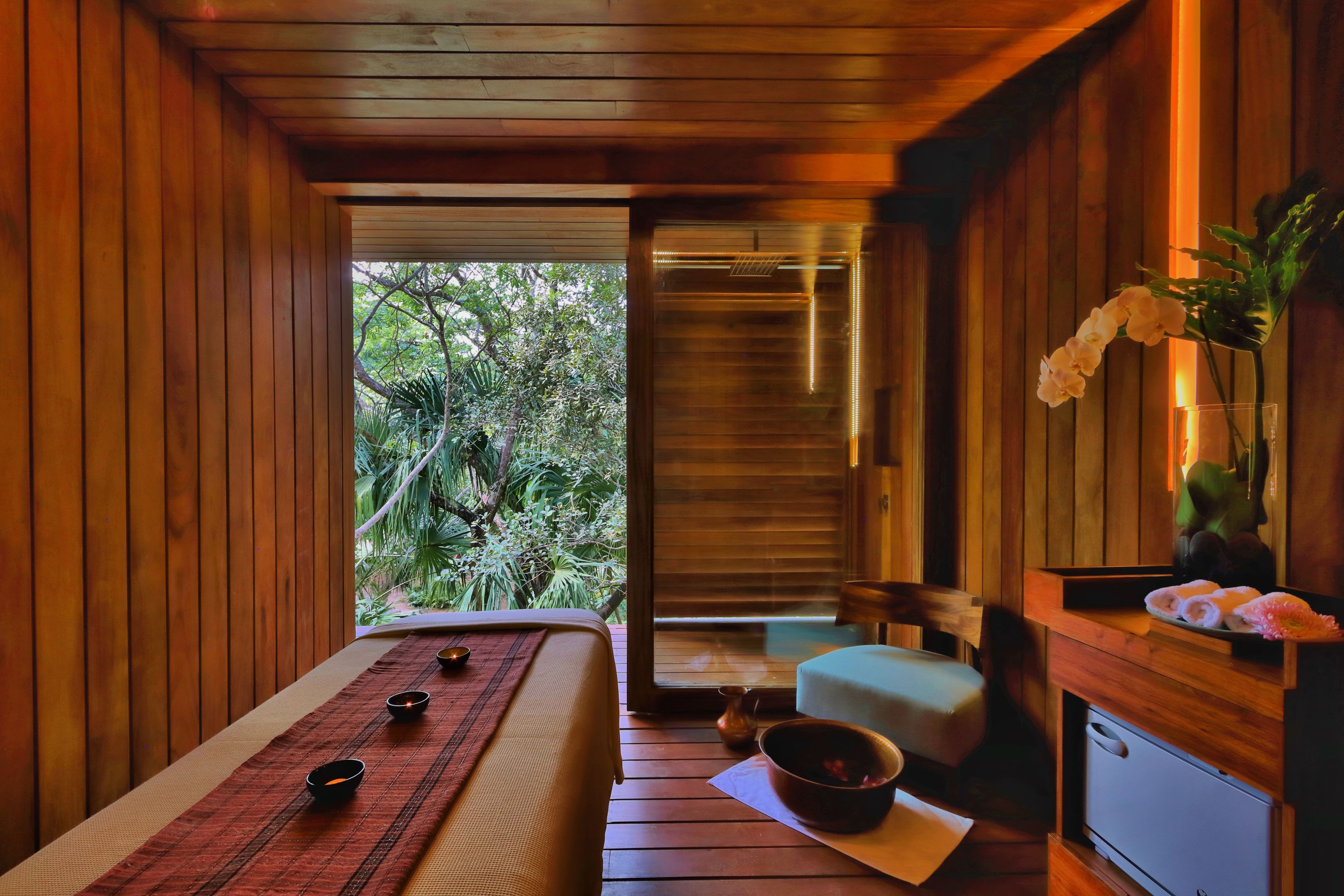 a room with a bed and a table and a chair