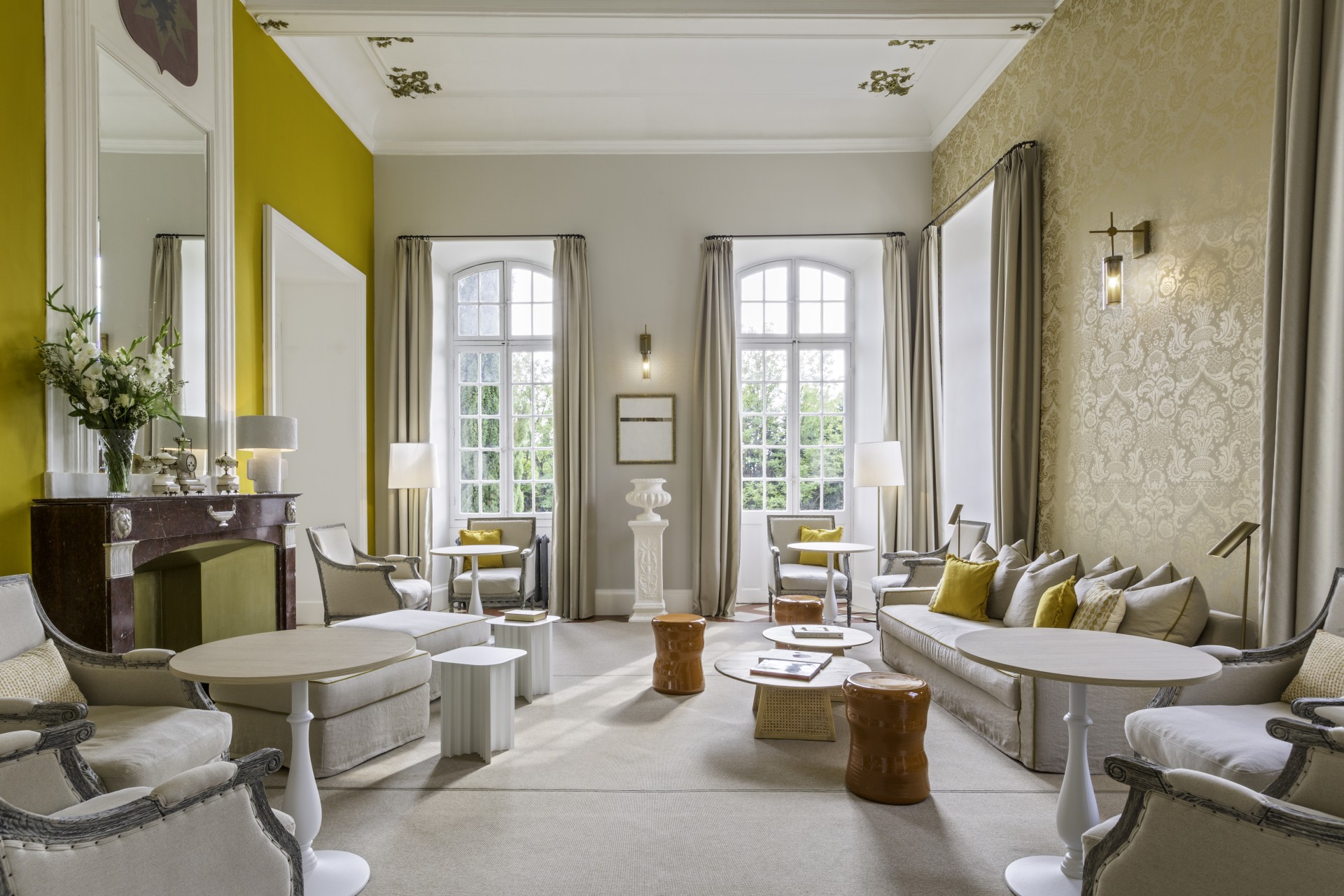 a room with a couch and tables
