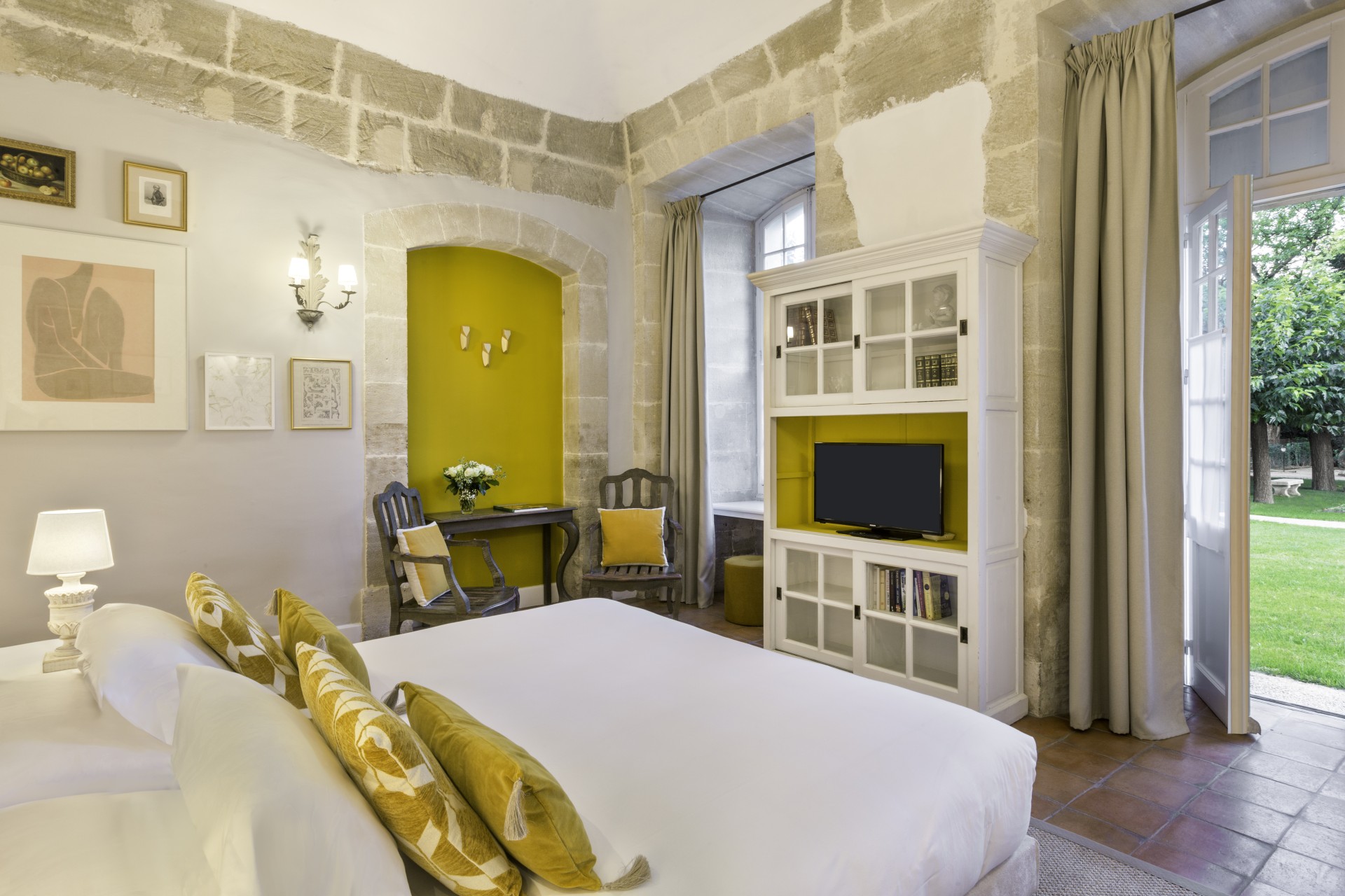 a room with a bed and a tv