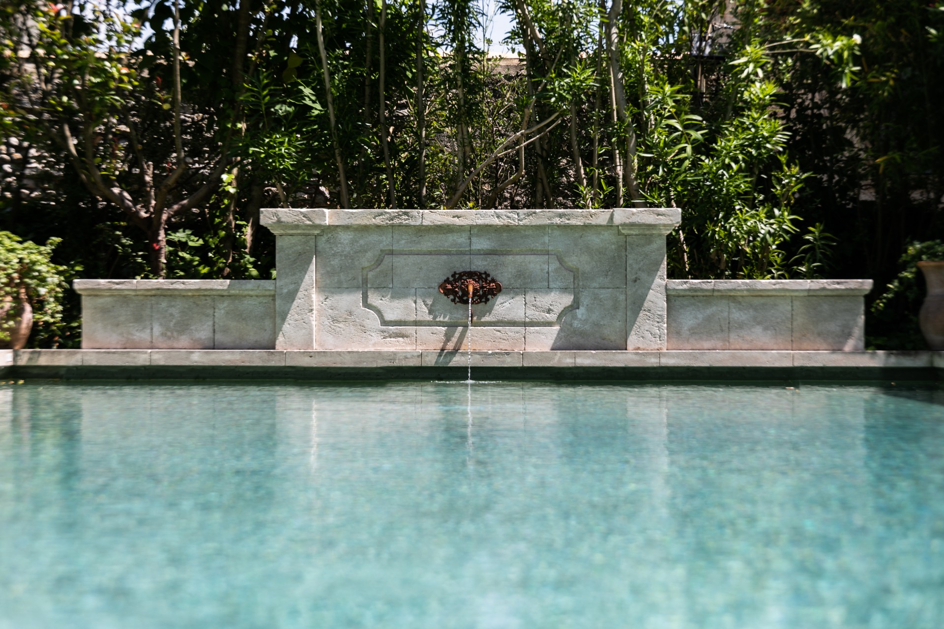 a water spouting into a pool