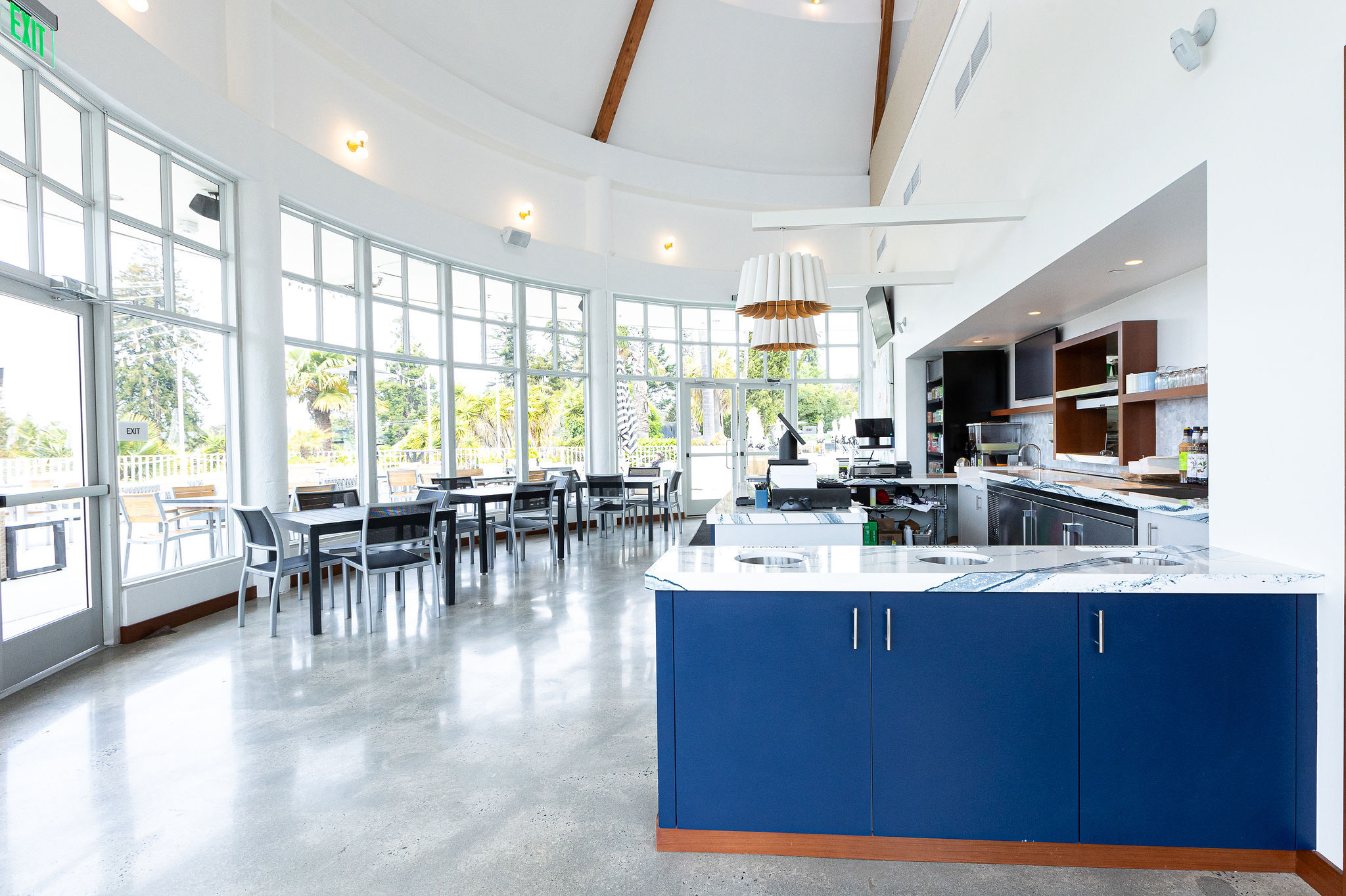 a room with a large window and a blue counter