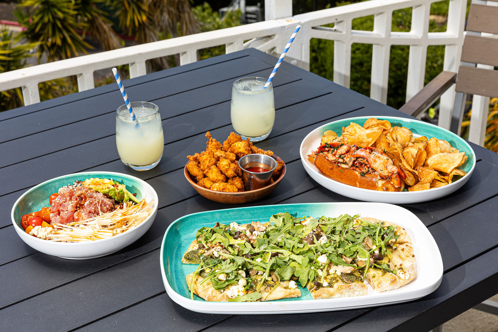 a table with plates of food and drinks