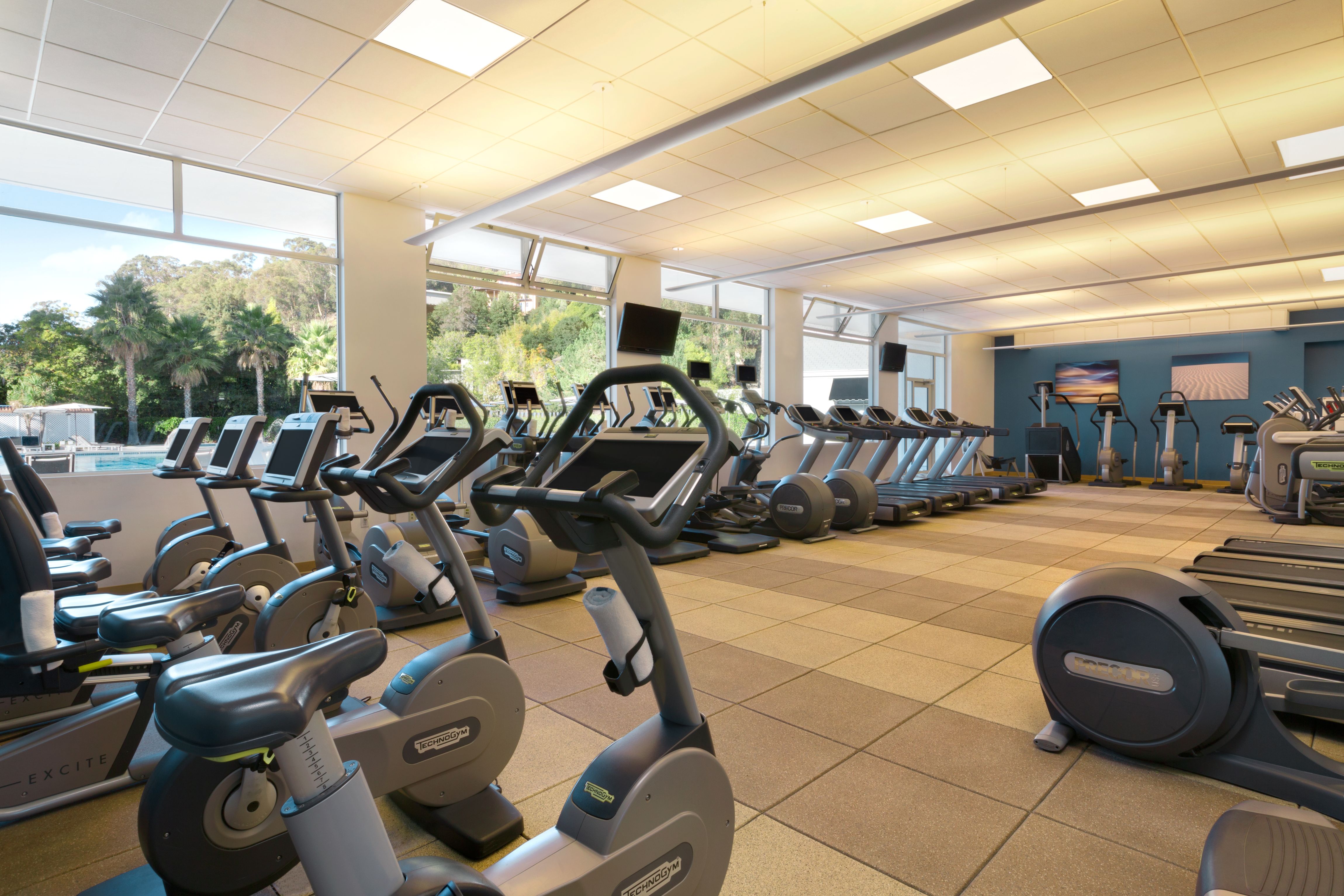 a large room with exercise bikes