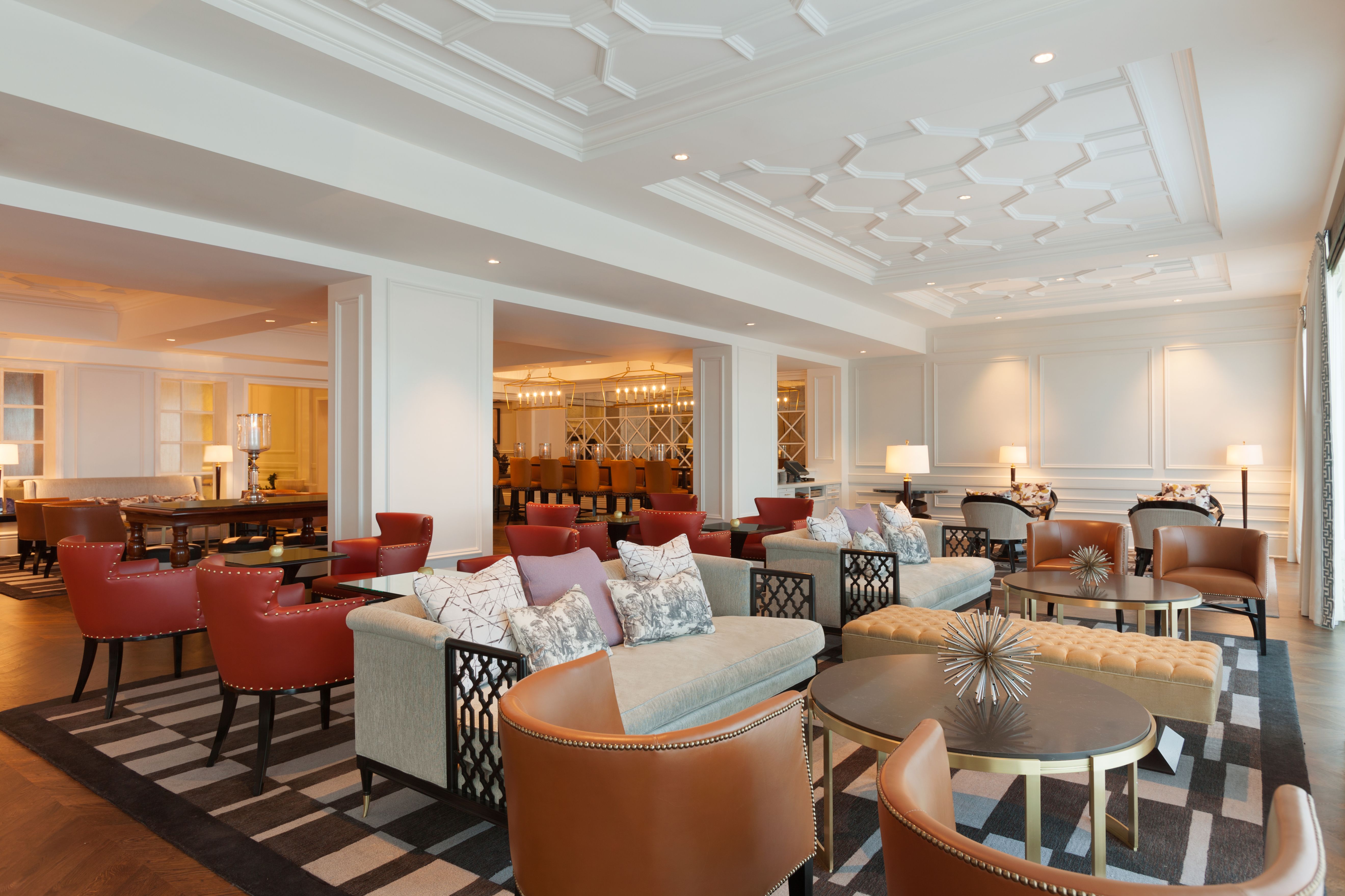 a room with a large group of chairs and tables