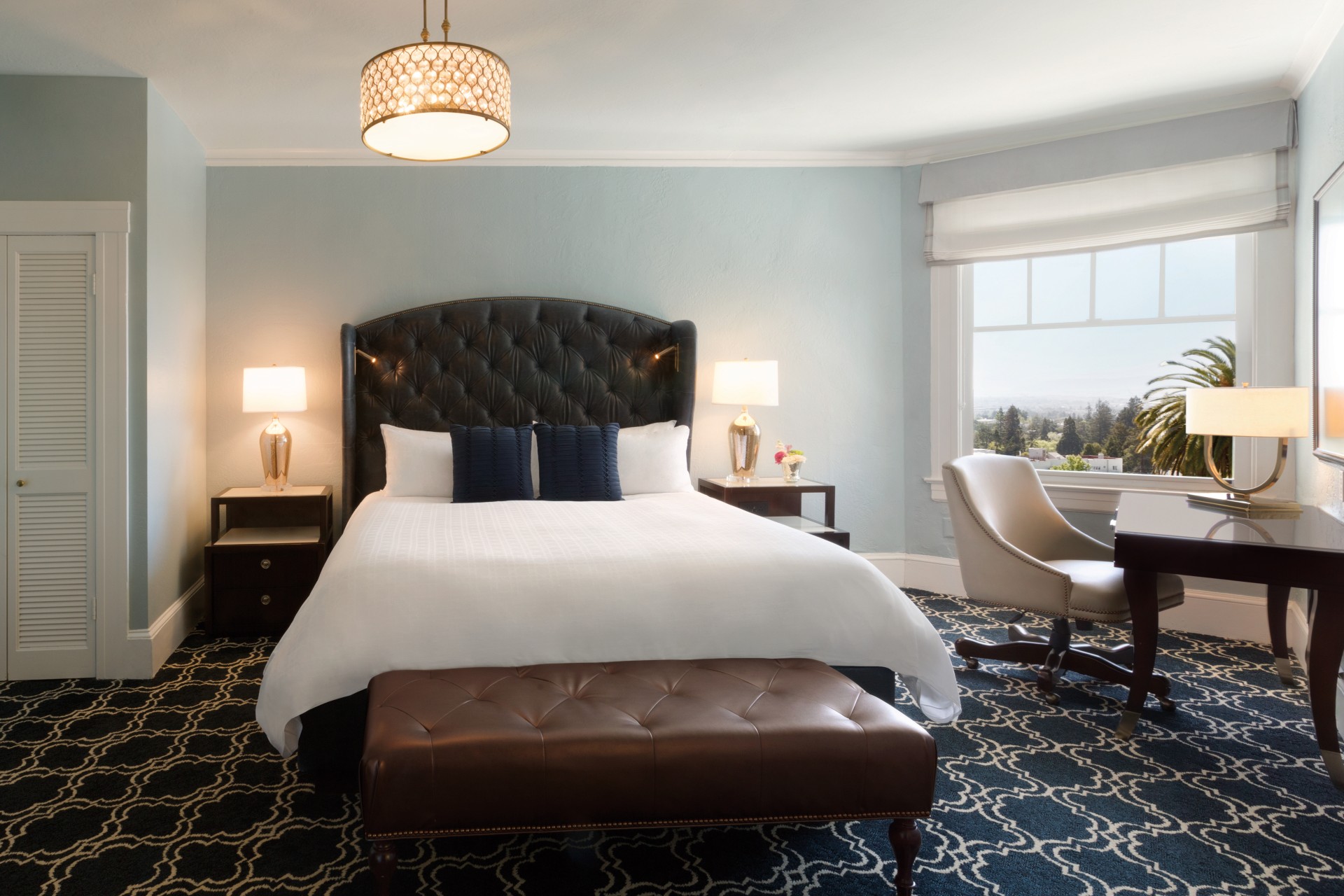 a bedroom with a bed and a chair