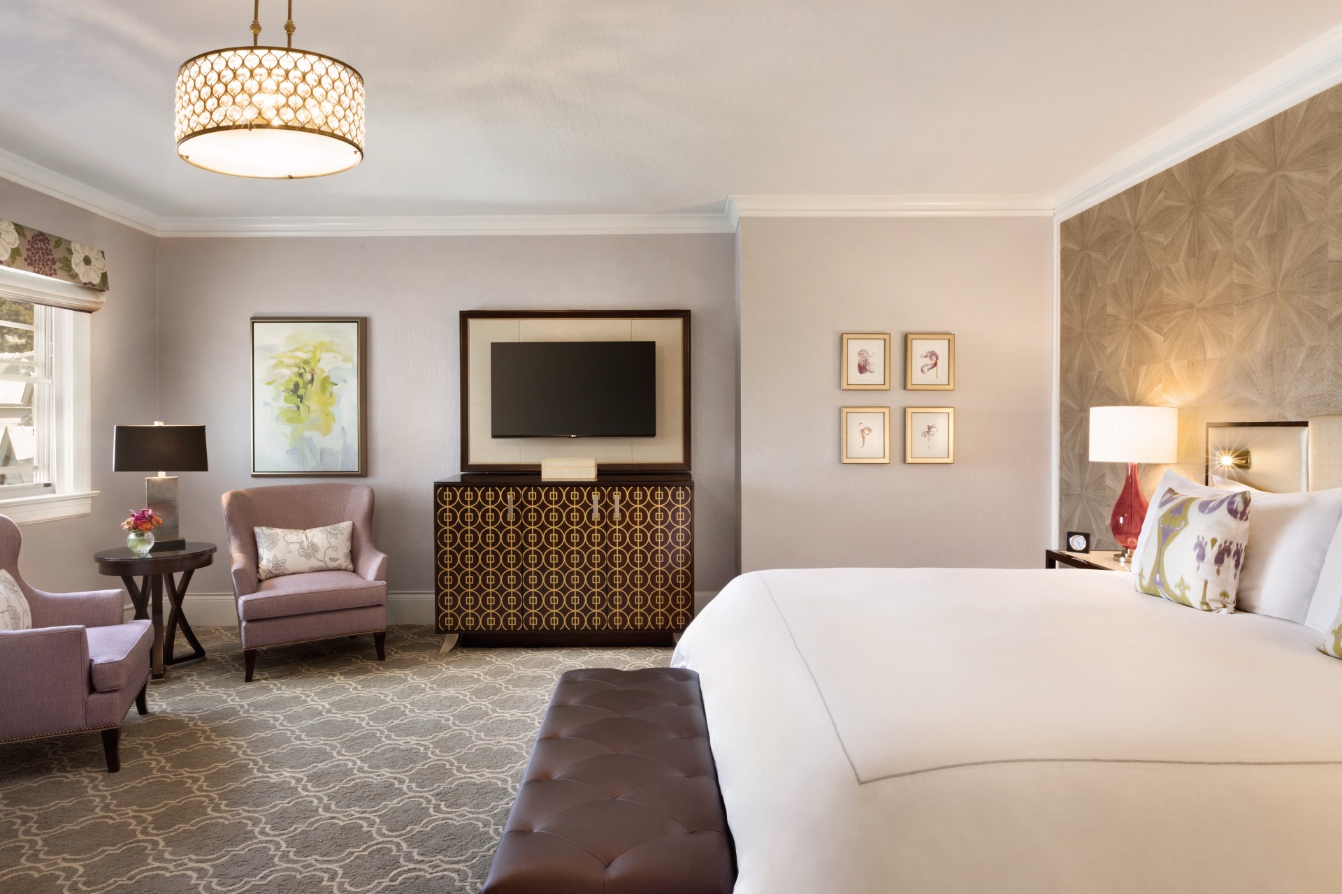 a bedroom with a bed and a television
